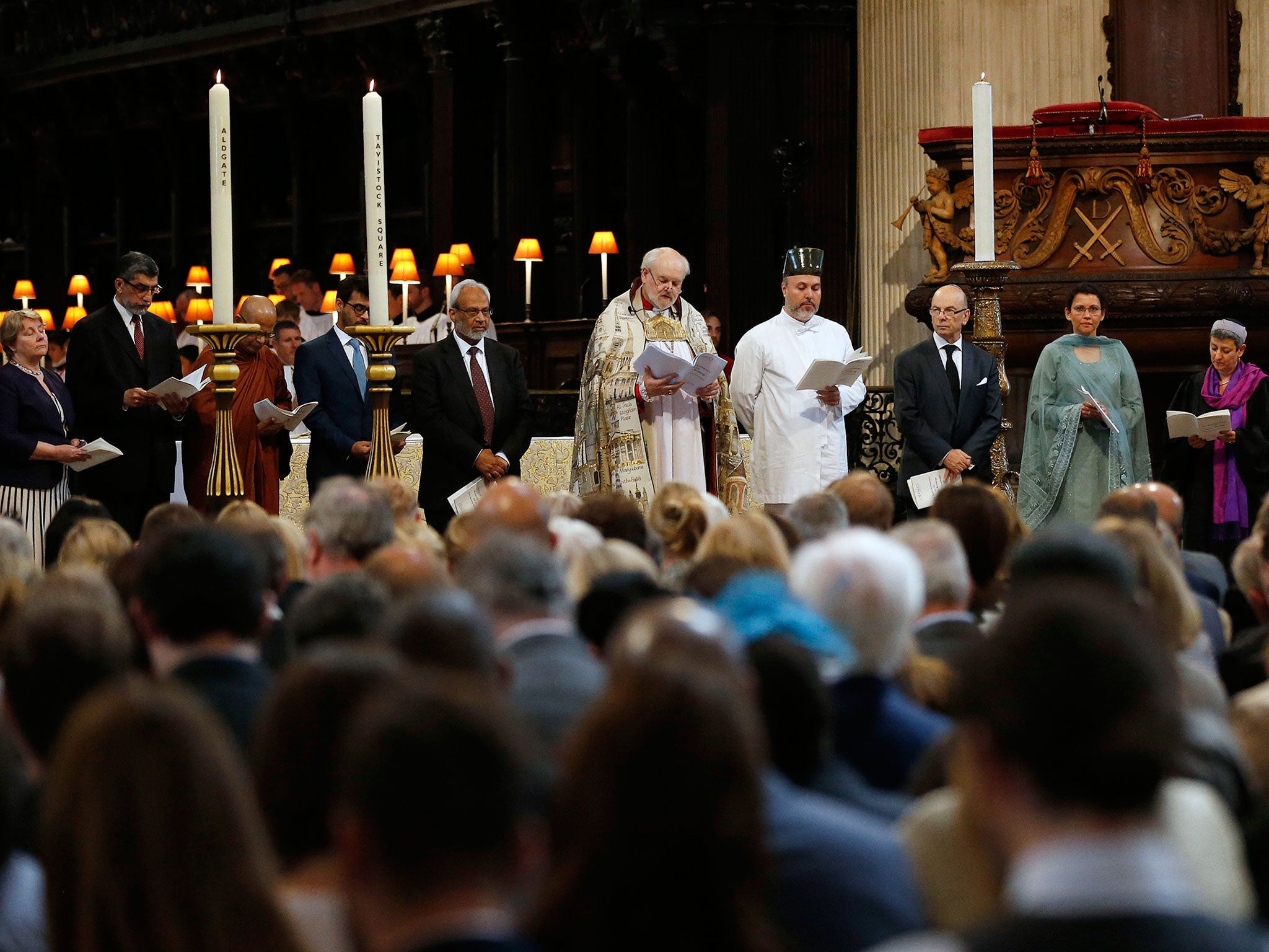 Members of various religious groups pray during a service in St Paul's Cathedral, to commemorate the tenth anniversary of the London Bombings in London