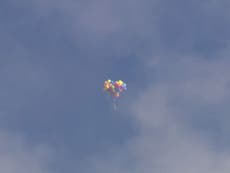 Man soars after tying 110 helium-balloons filled to his lawn chair