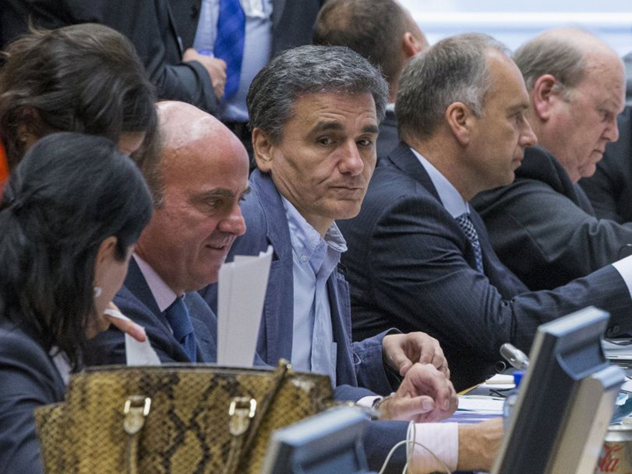 Newly appointed Greek Finance Minister (C) attends a euro zone finance ministers meeting on the situation in Greece in Brussels, Belgium, July 7, 2015