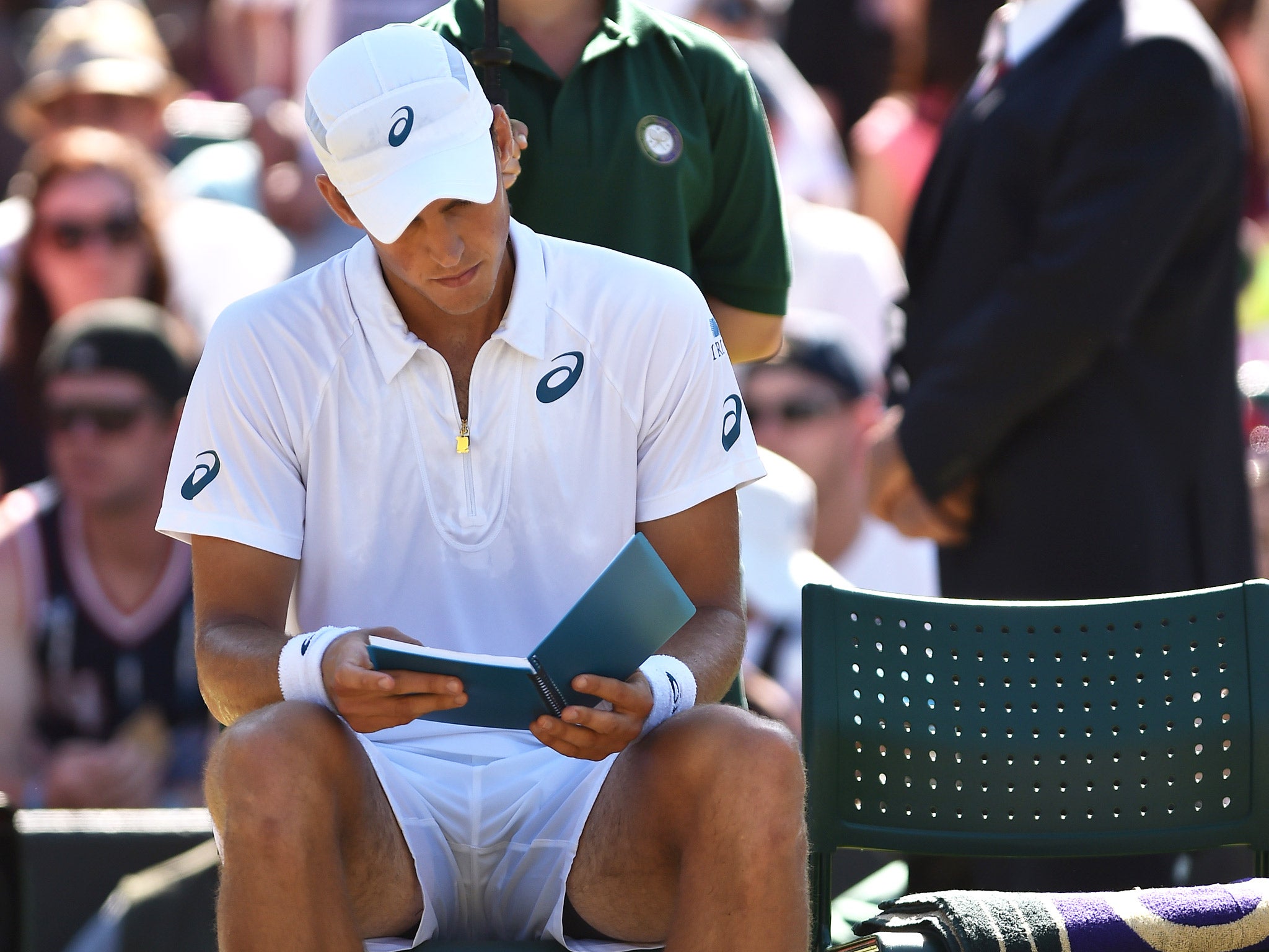 Vasek Pospisil consults his notebook earlier in the tournament