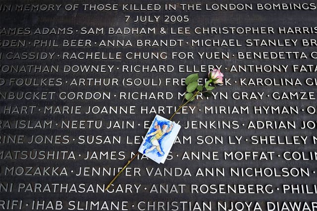 A flower lies on a plaque bearing the names of victims at the 7/7 memorial, on the 10th anniversary of the attacks, in Hyde Park