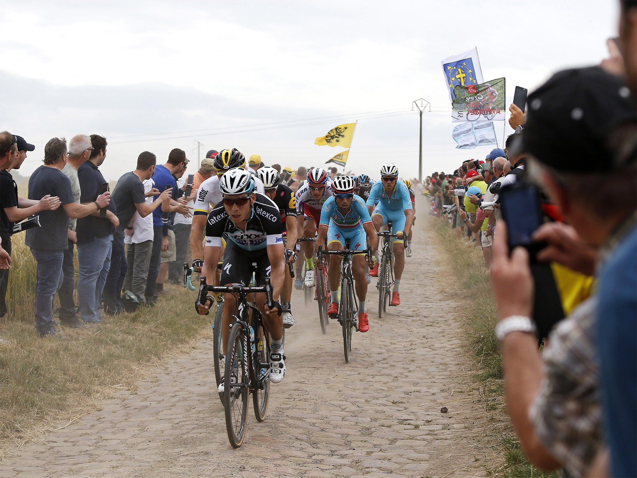 Tony Martin leads on the cobbled stones on his way to victory and the yellow jersey in Tuesday’s fourth stage of the Tour de France