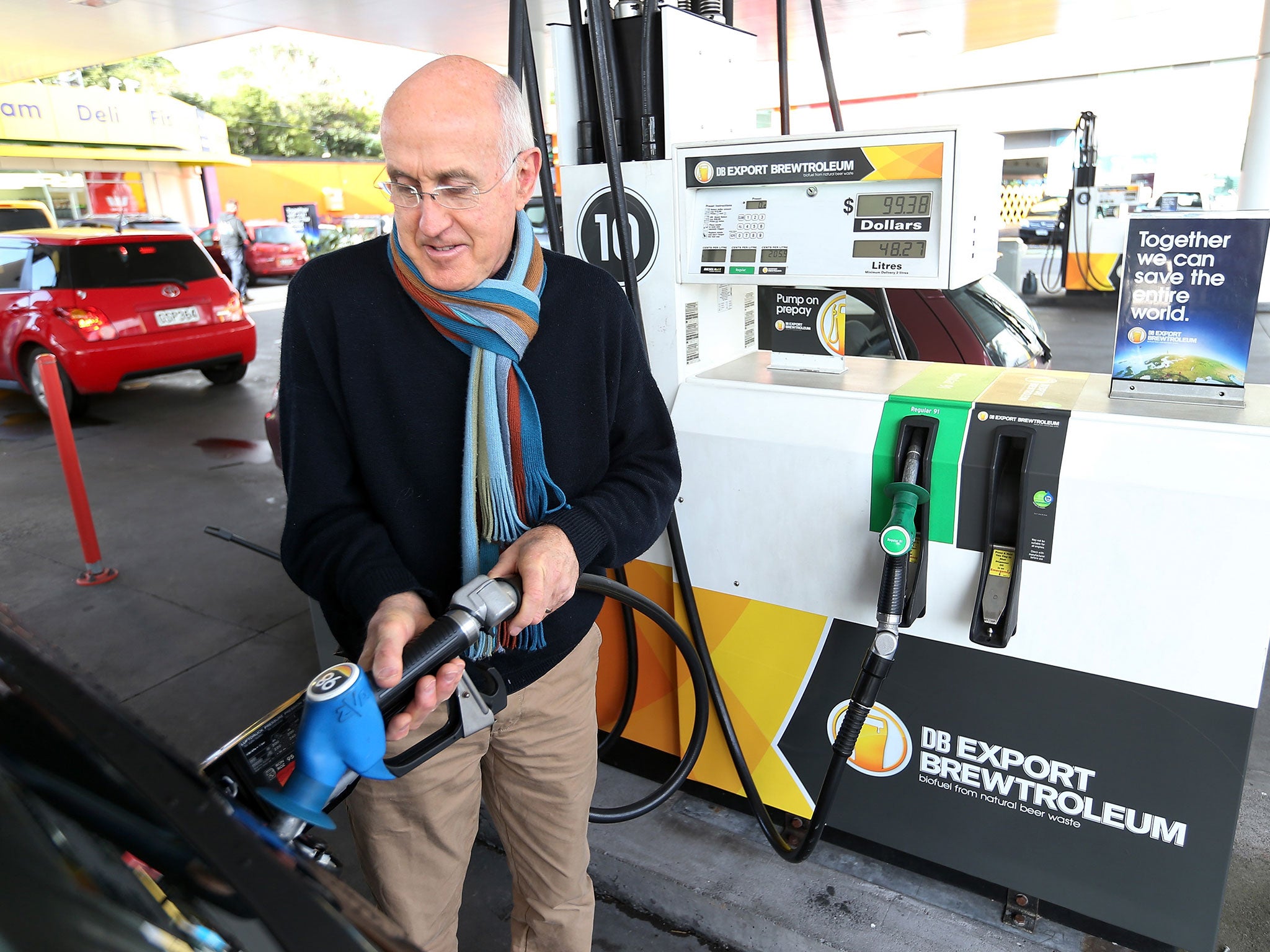 A driver fills up his car with Brewtroluem biofuel in New Zealand