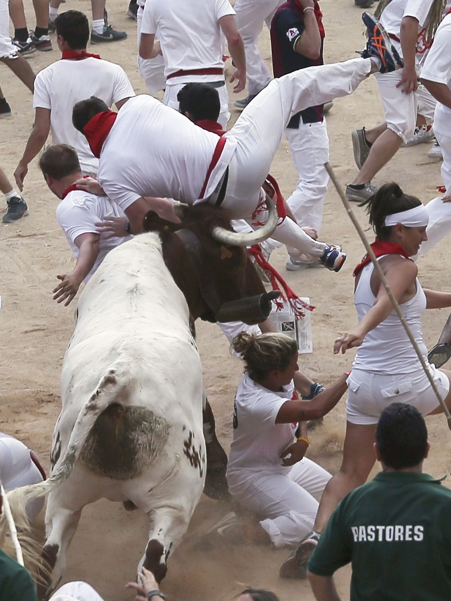A runner is gored by a bull