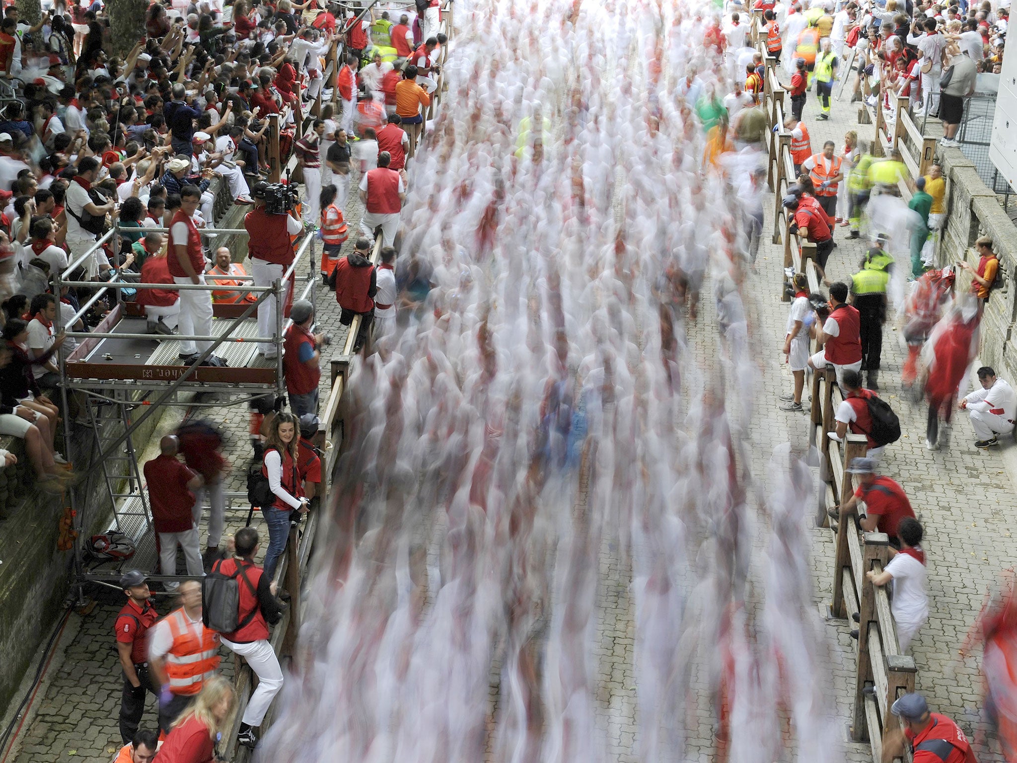 Thousands of runners enter the bullring in Pamplona