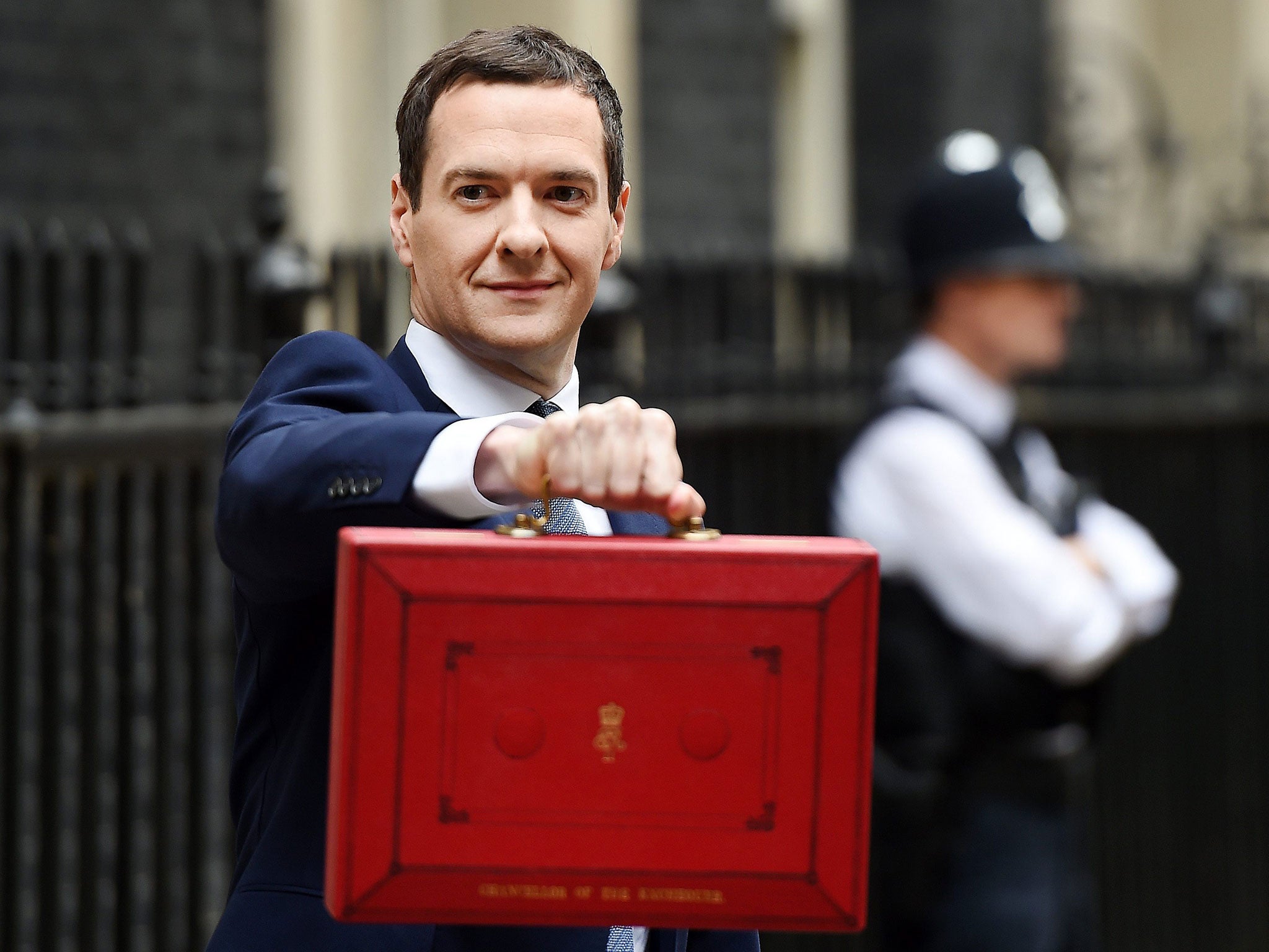 George Osborne holds up the red briefcase outside No 11 Downing Street prior to announcing his budget to parliament in London