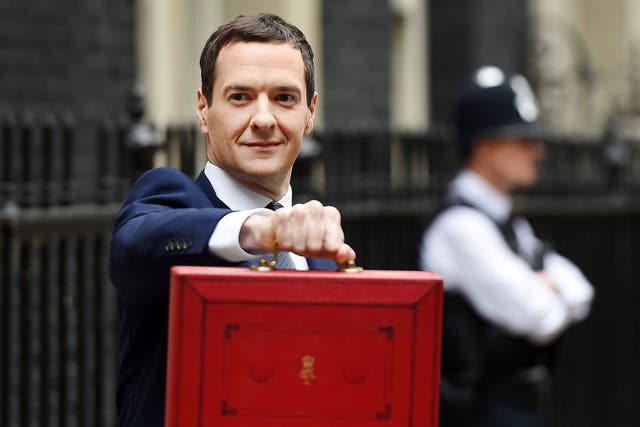 George Osborne holds up the red briefcase outside No 11 Downing Street prior to announcing his budget to parliament in London 