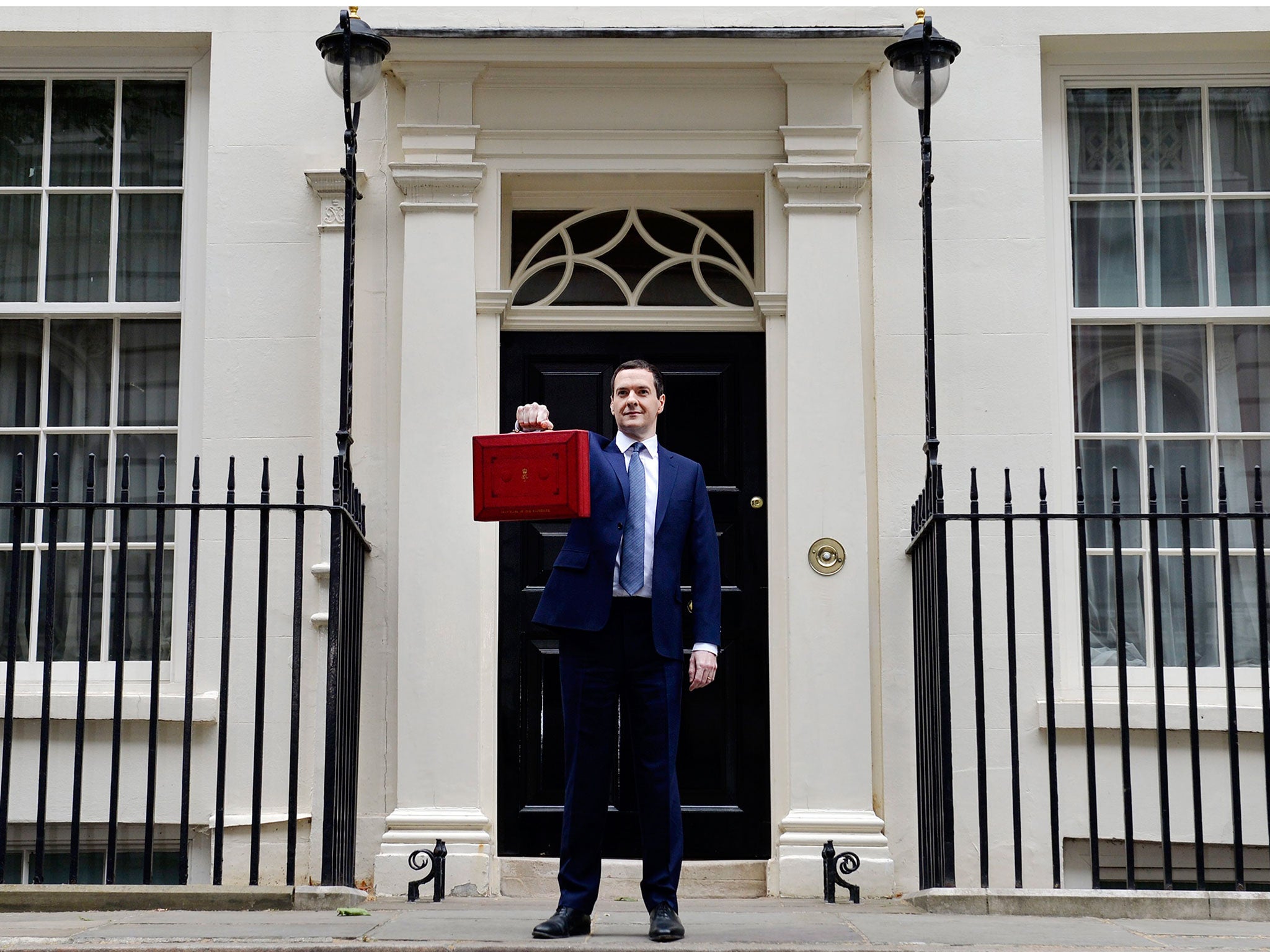 George Osborne holds up the red briefcase outside No 11 Downing Street prior to announcing his budget to parliament in London