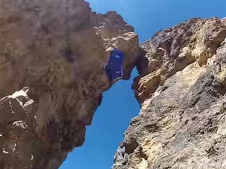 wingsuit defying metre stunt