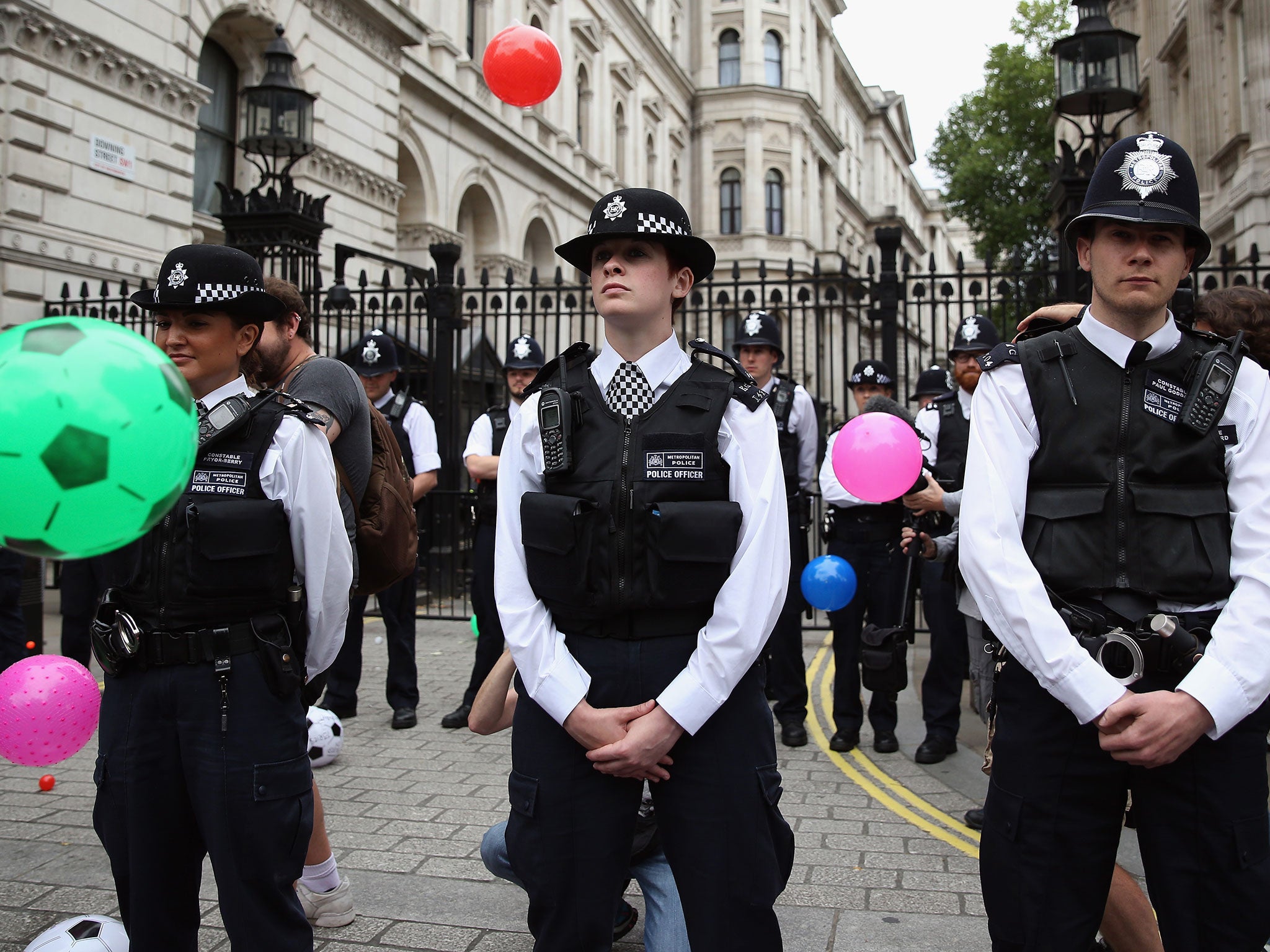 Anti-austerity protesters throw balls towards Downing Street