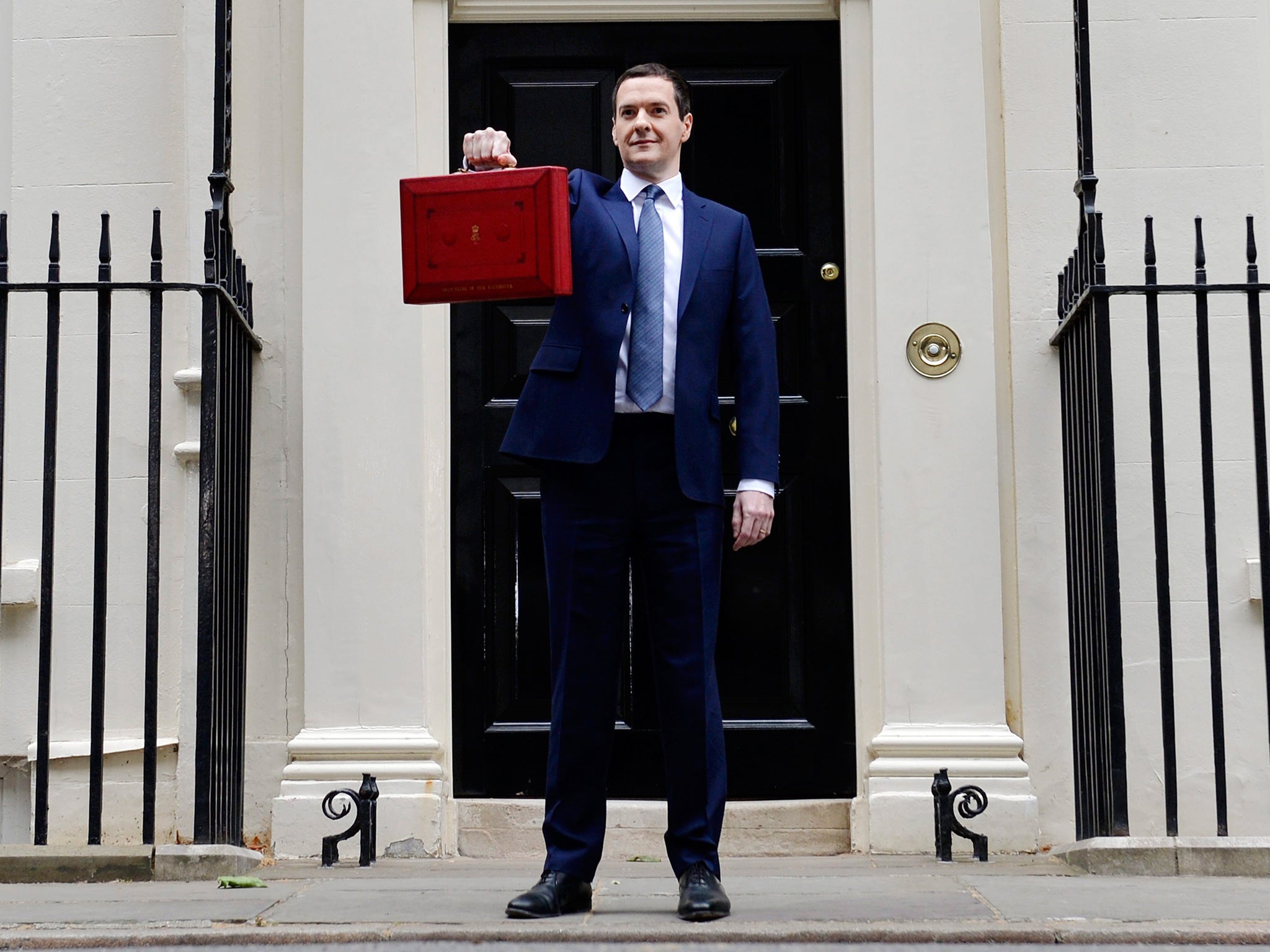 George Osborne holds up the red briefcase outside No 11 Downing Street