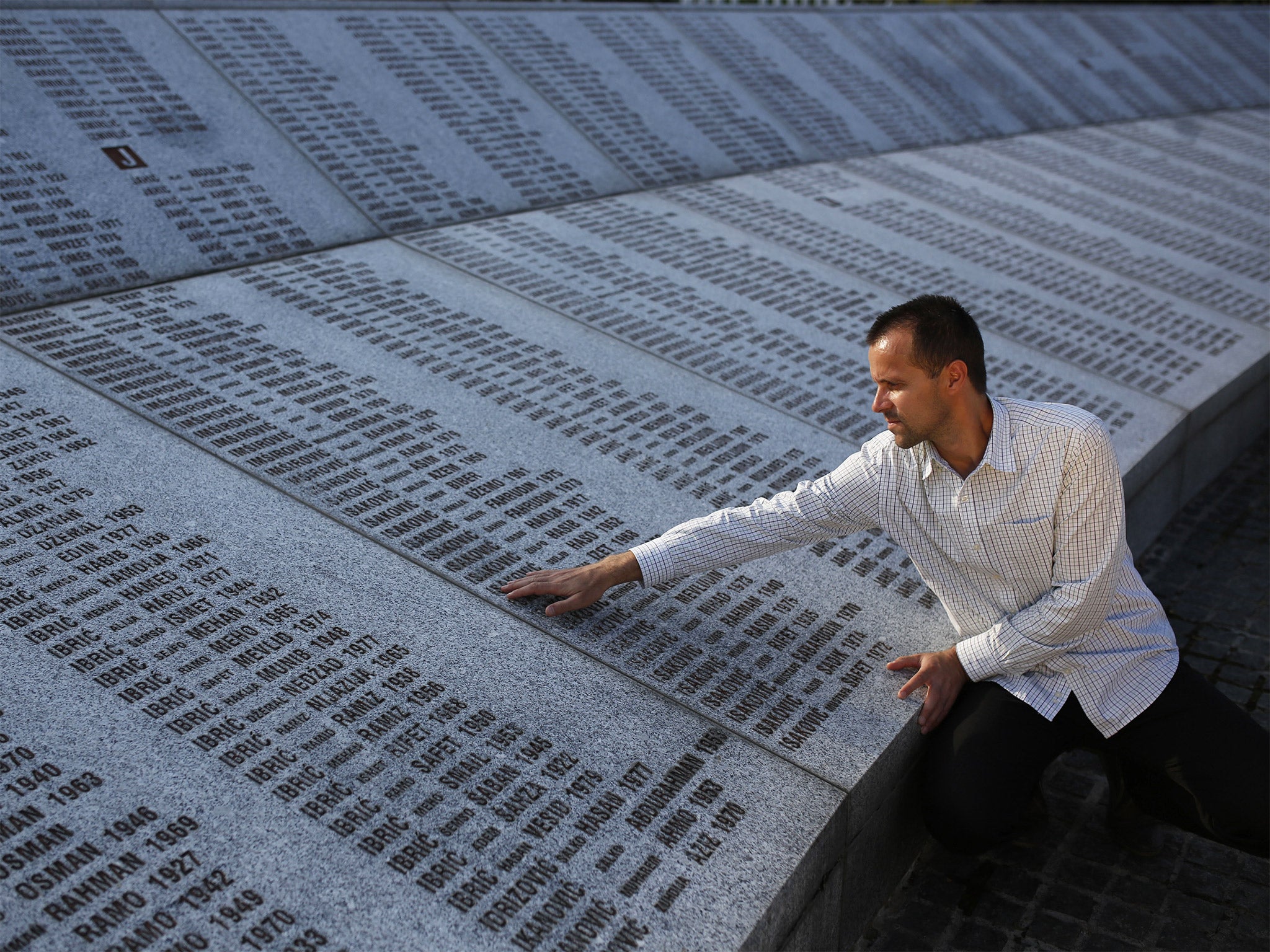 A mourner at the Srebrenica Genocide Memorial