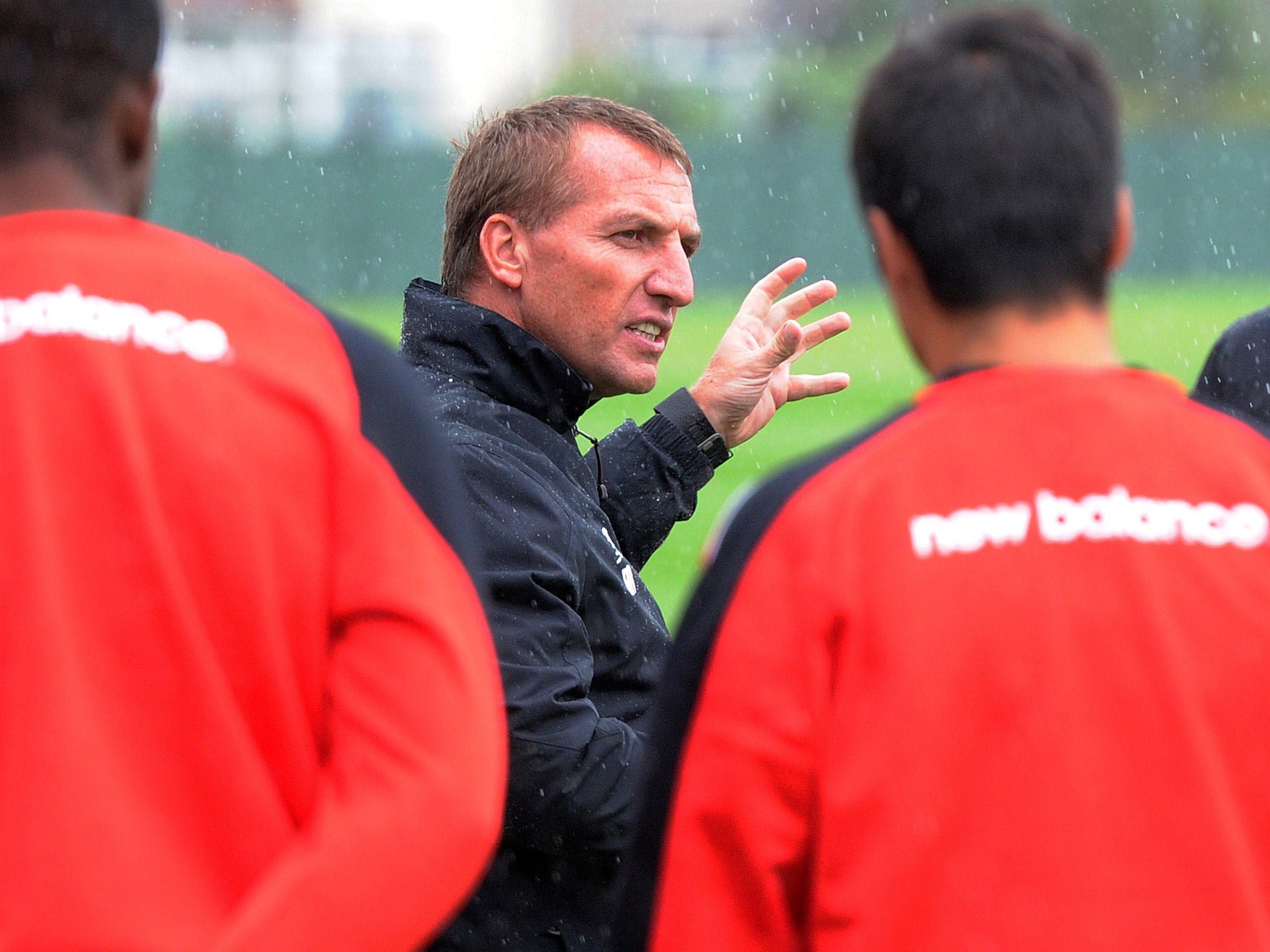 Brendan Rodgers talks to his players during a training session earlier this week