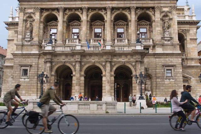 Take in city icons such as the Opera House by bike