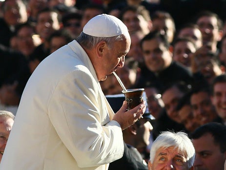 Pope Francis drinking mate, a traditional South American caffeine drink, at the Vatican in 2014