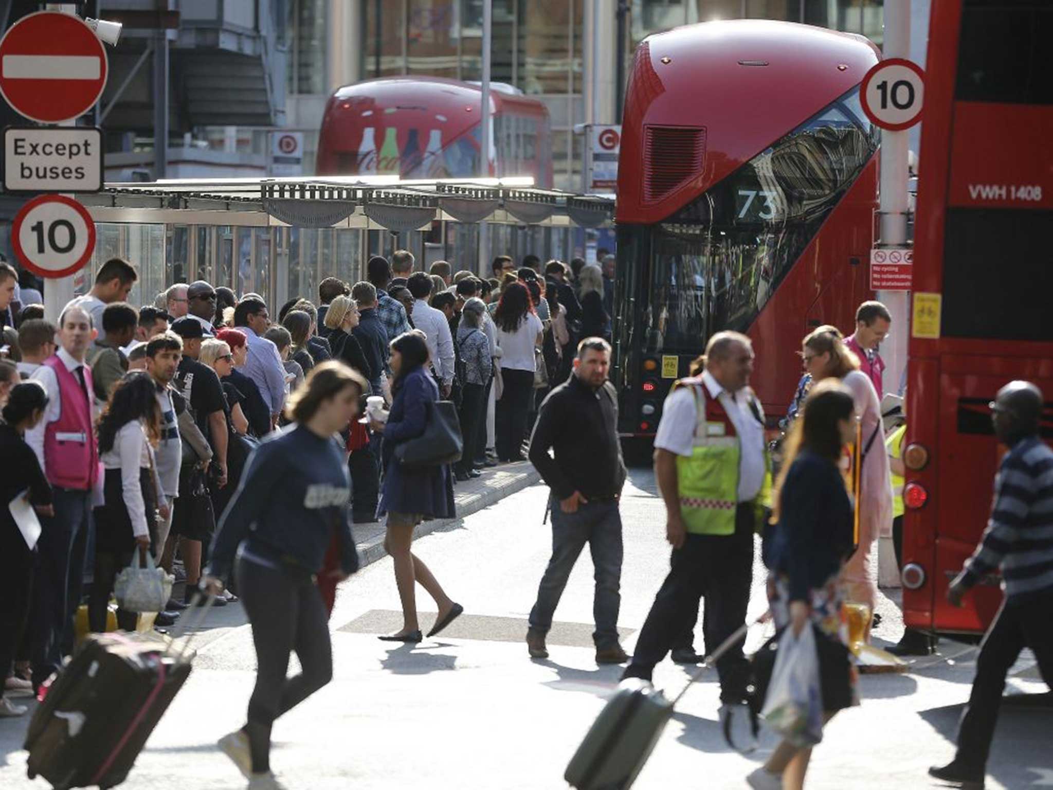 Commuters queue for buses as tube drivers are on strike in London
