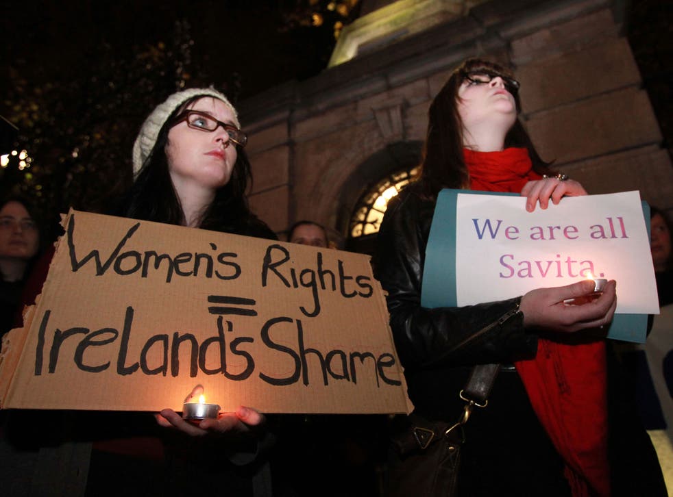 Abortion rights protesters gather outside the Irish parliament building after the death of Savita Halappanavar, who died during a miscarriage after she was denied an abortion