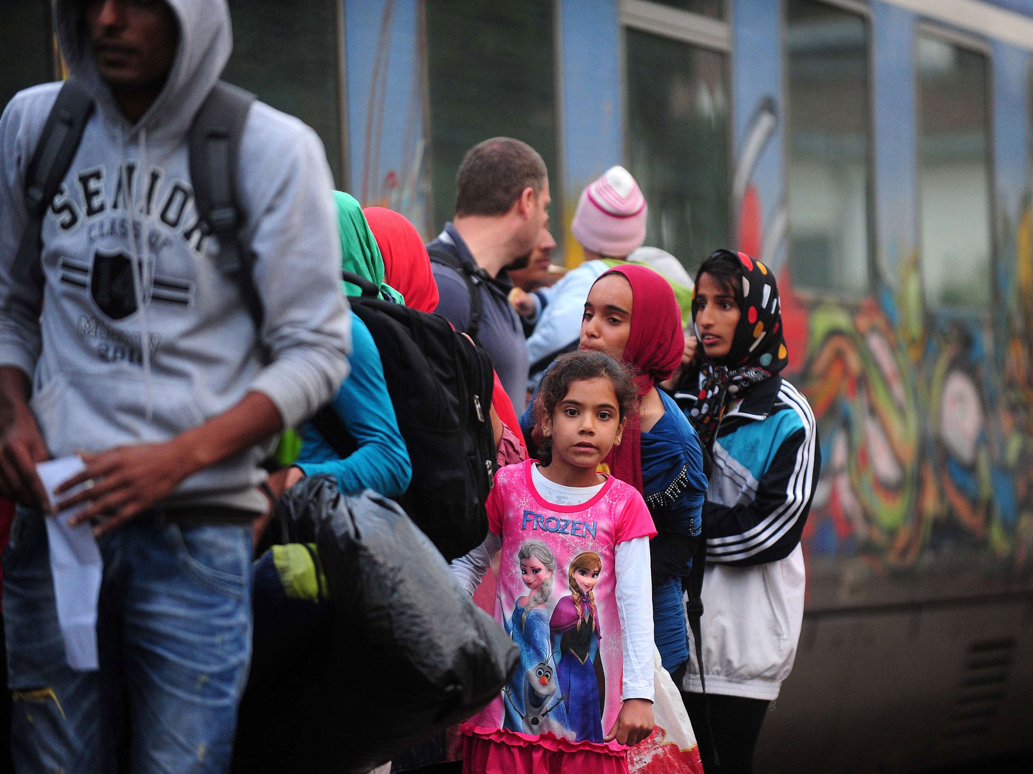 Migrants arrive at the Macedonian-Greek border