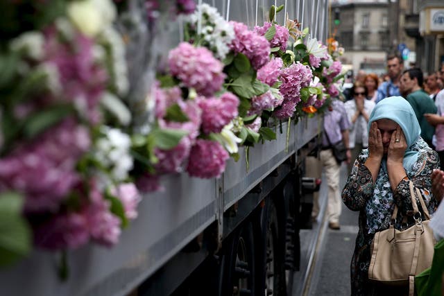 A truck carries Srebrenica victims through Sarajevo