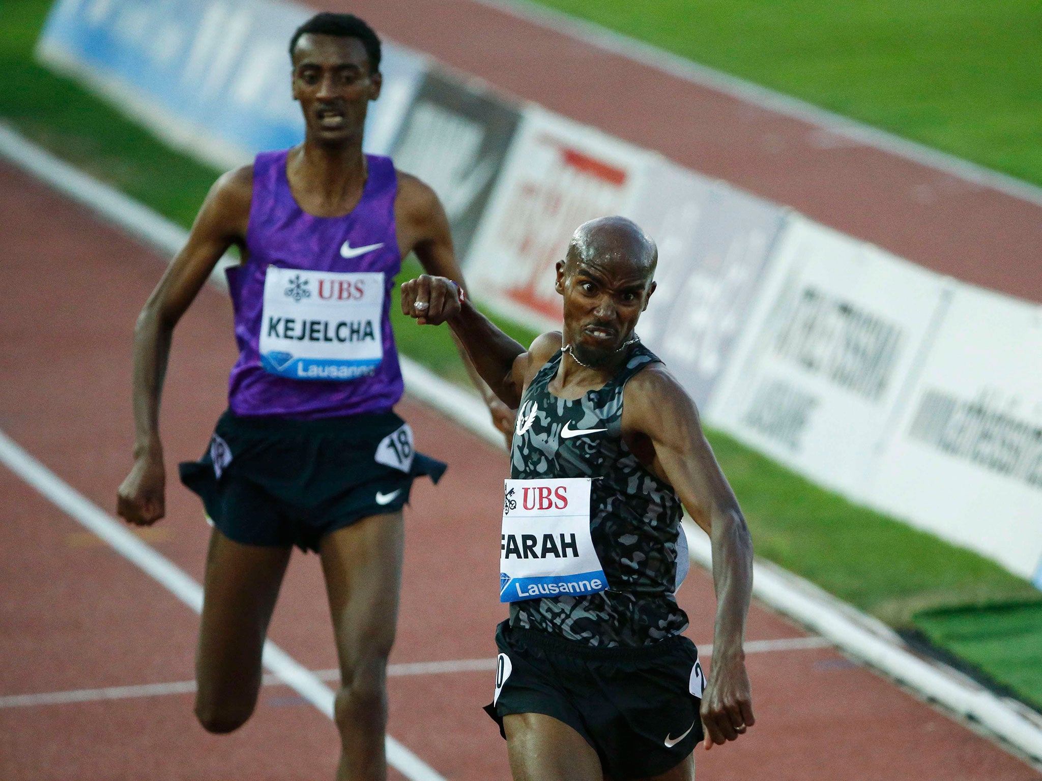 Mo Farah punches the air as he beats Ethiopian Yomif Kejelcha across the line in Lausanne