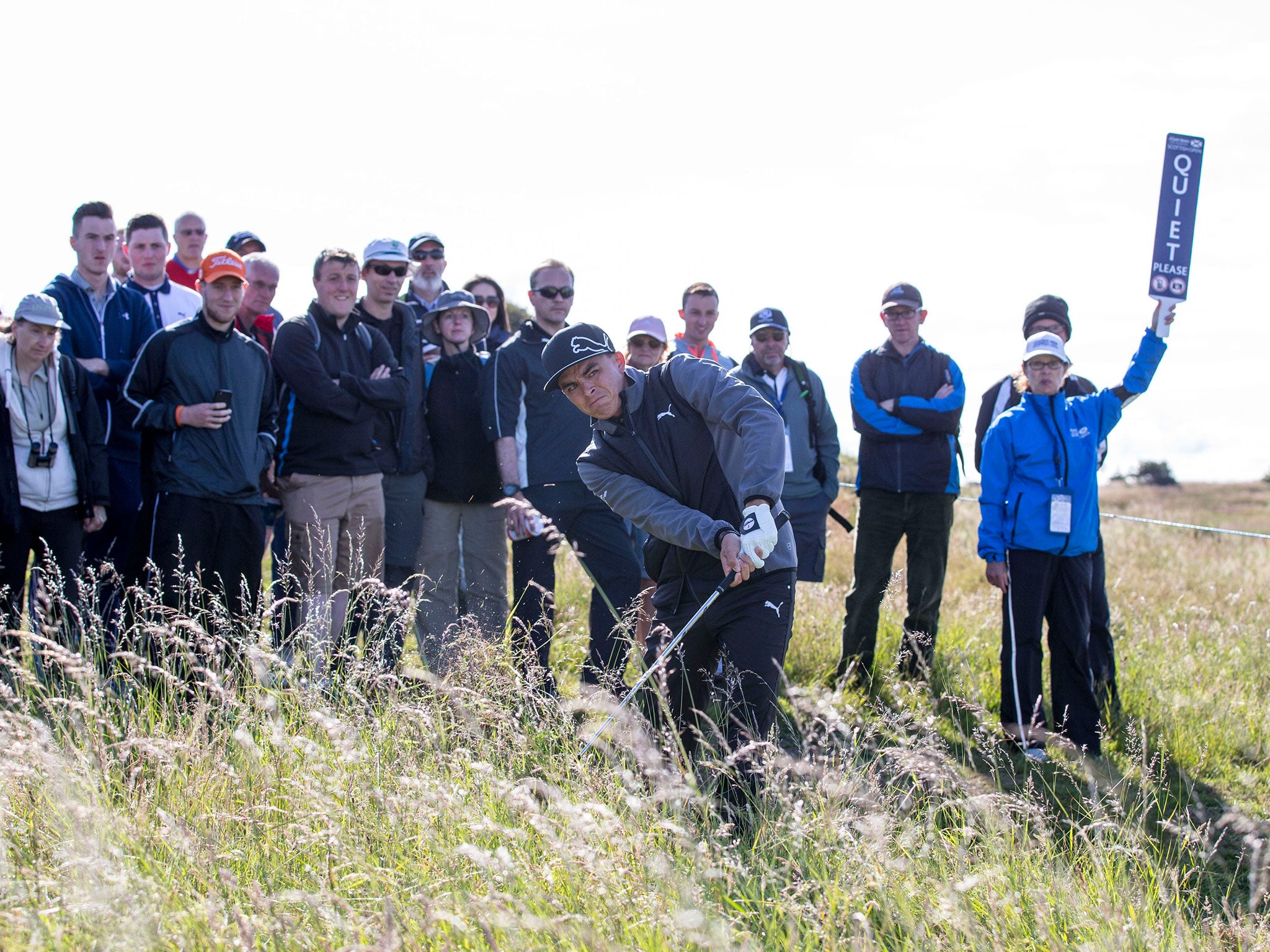Rickie Fowler, of the United States, chips out of the rough during his first round at the Scottish Open at Gullane