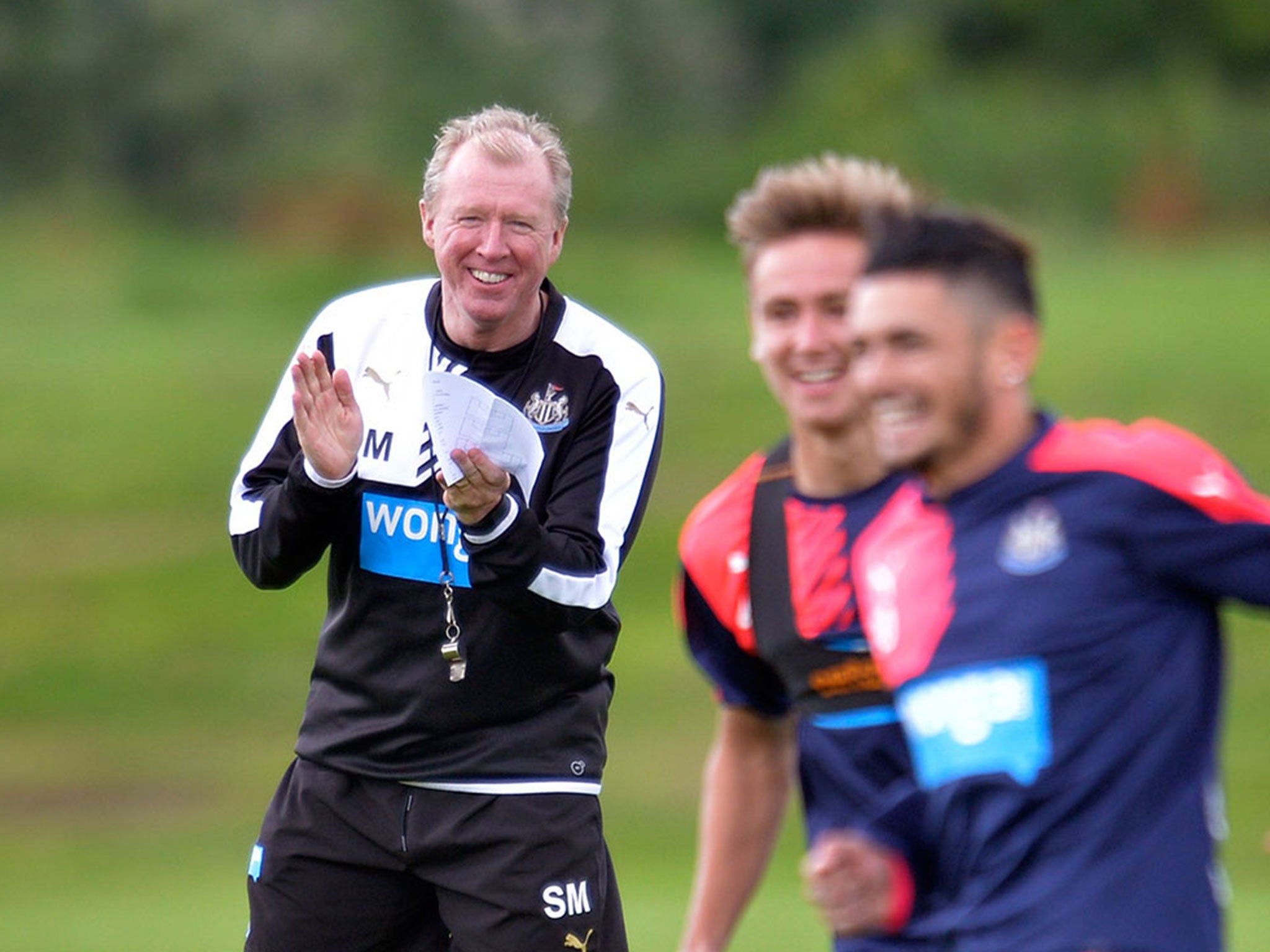 Newcastle’s new manager Steve McClaren, left, shares a laugh with his players during training