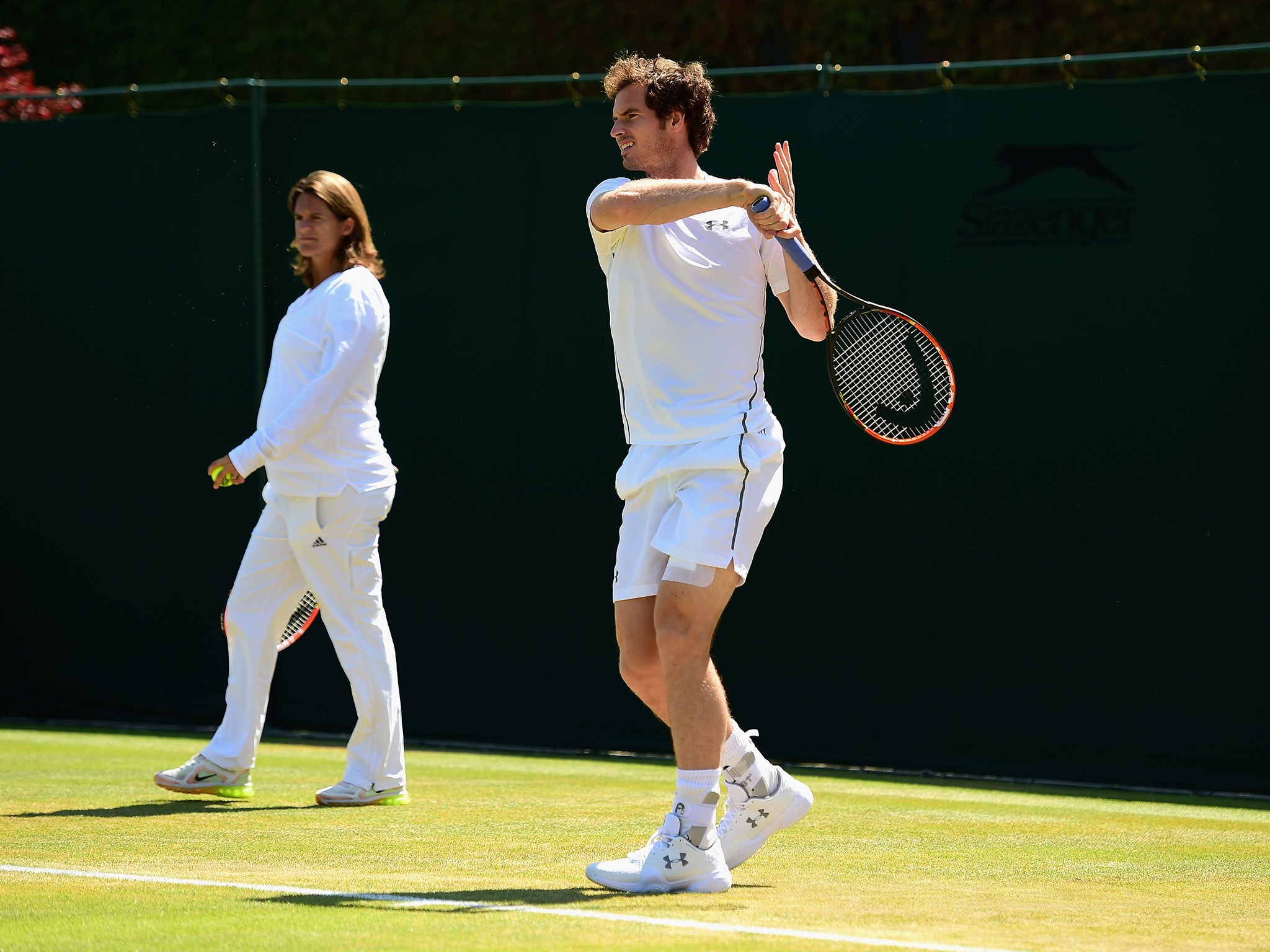Andy Murray, watched by coach Amélie Mauresmo, practises ahead of his semifinal with Roger Federer