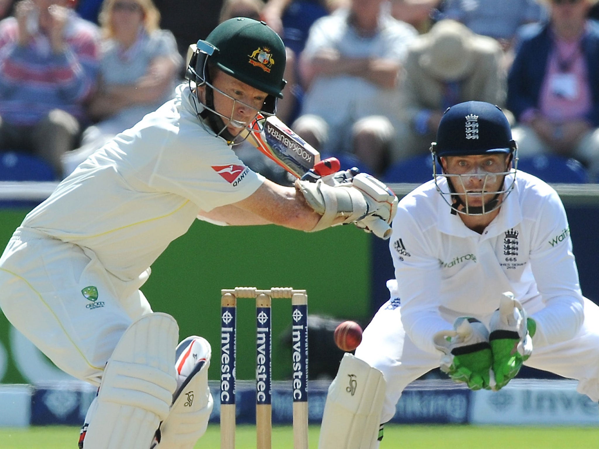 Australia opener Chris Rogers lines up a shot, closely watched by England wicketkeeper Jos Buttler