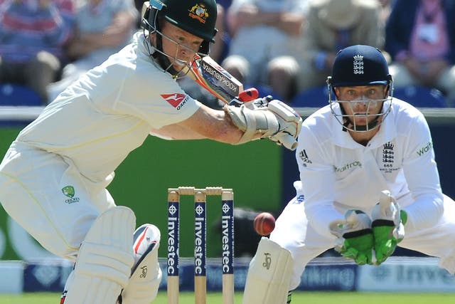 Australia opener Chris Rogers lines up a shot, closely watched by England wicketkeeper Jos Buttler