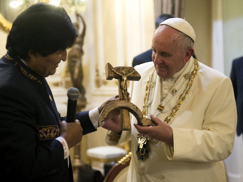 Bolivian President Evo Morales present Pope Francis with a crucifix mounted on a Communist hammer and sickle