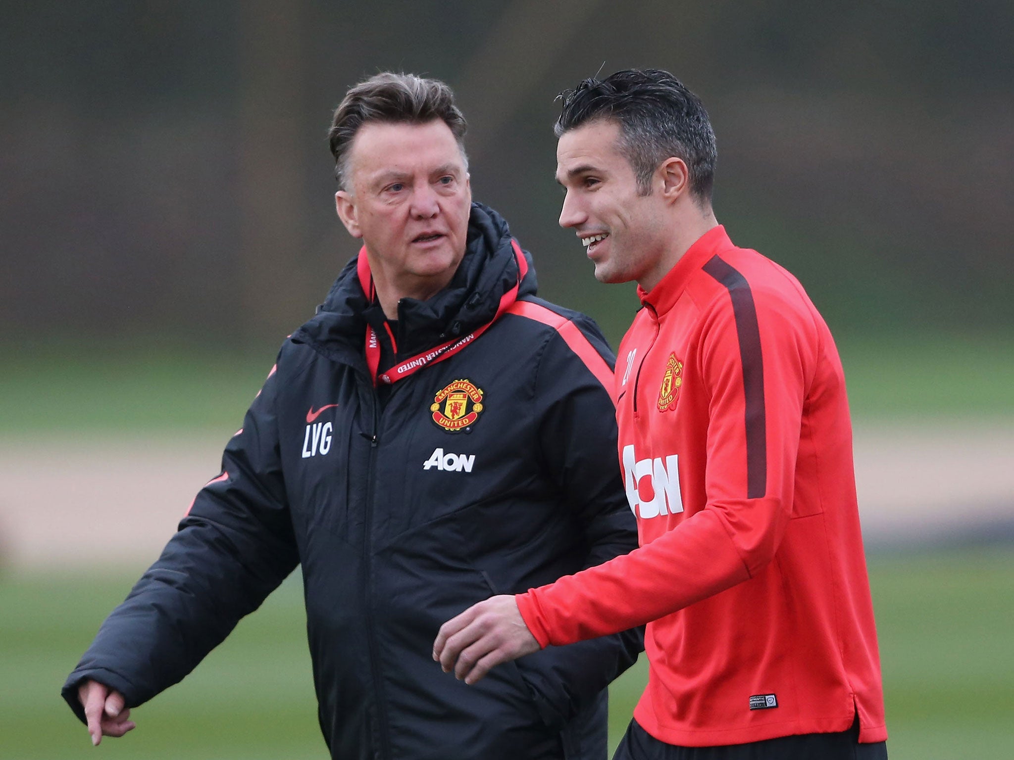 Louis van Gaal and Robin van Persie share a happier moment at Manchester United