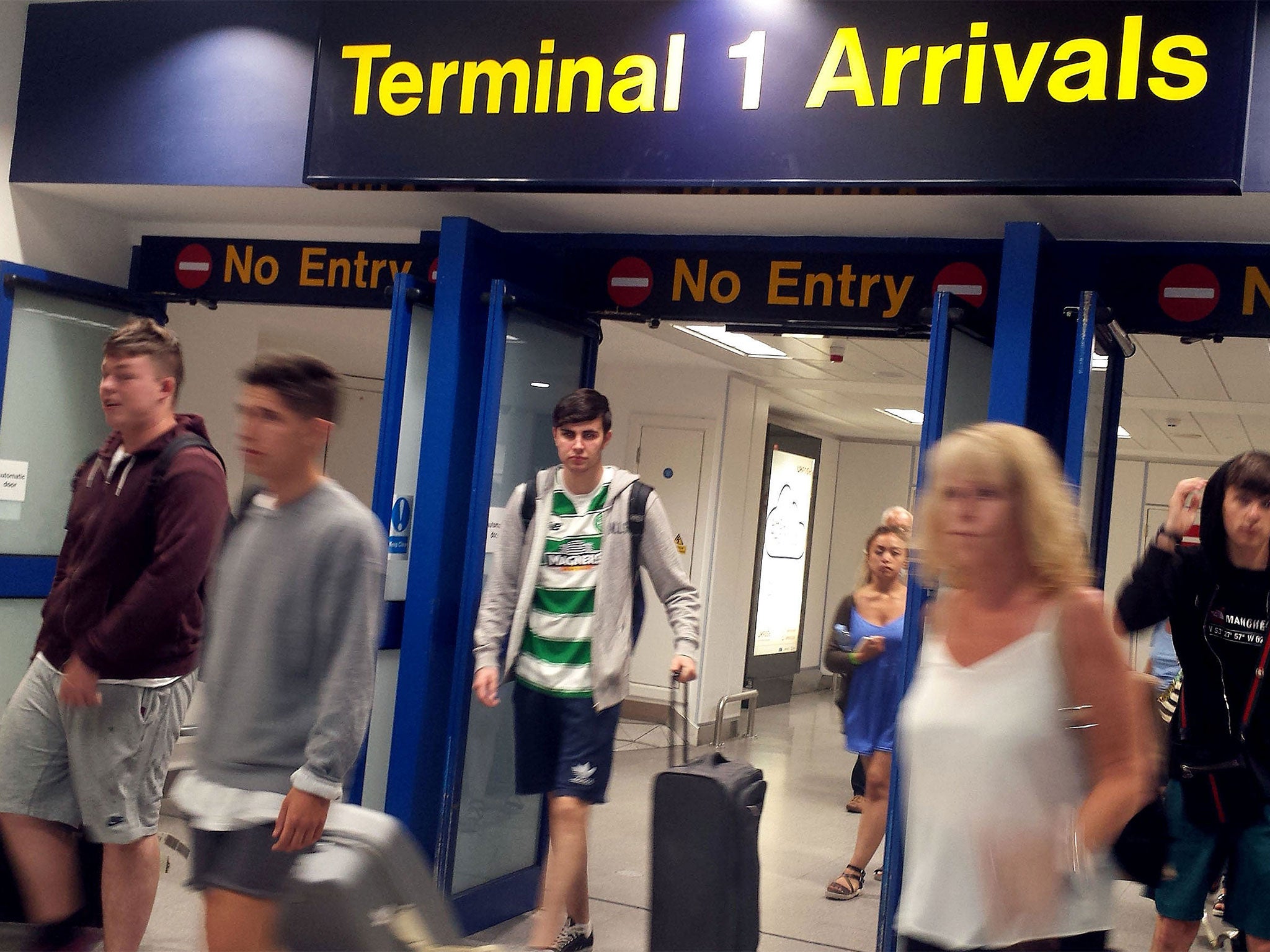 Passengers arrive back from Tunisia at Manchester Airport