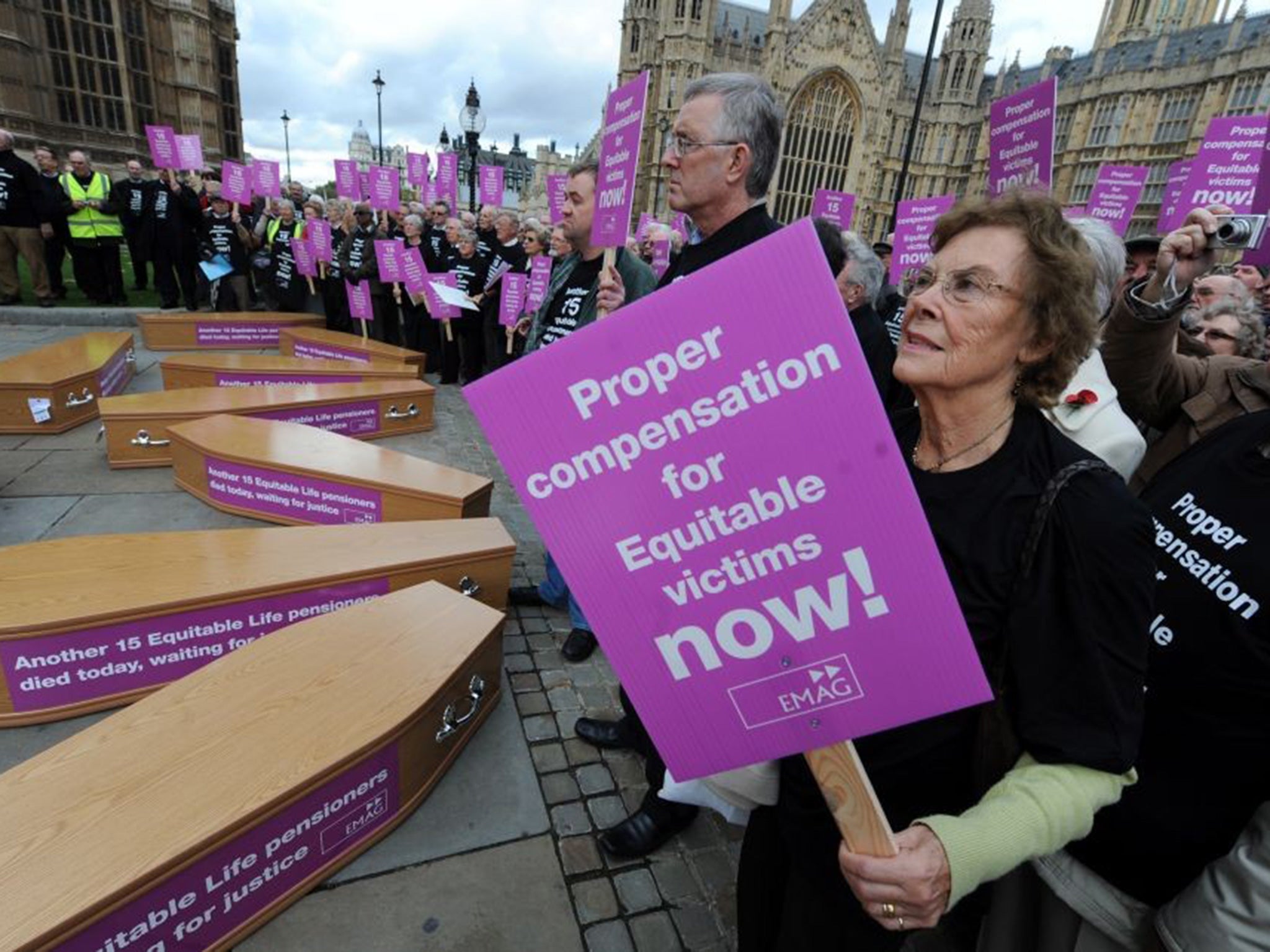 Pensioners caught by the financial crisis at the insurer protest outside Parliament in 2009
