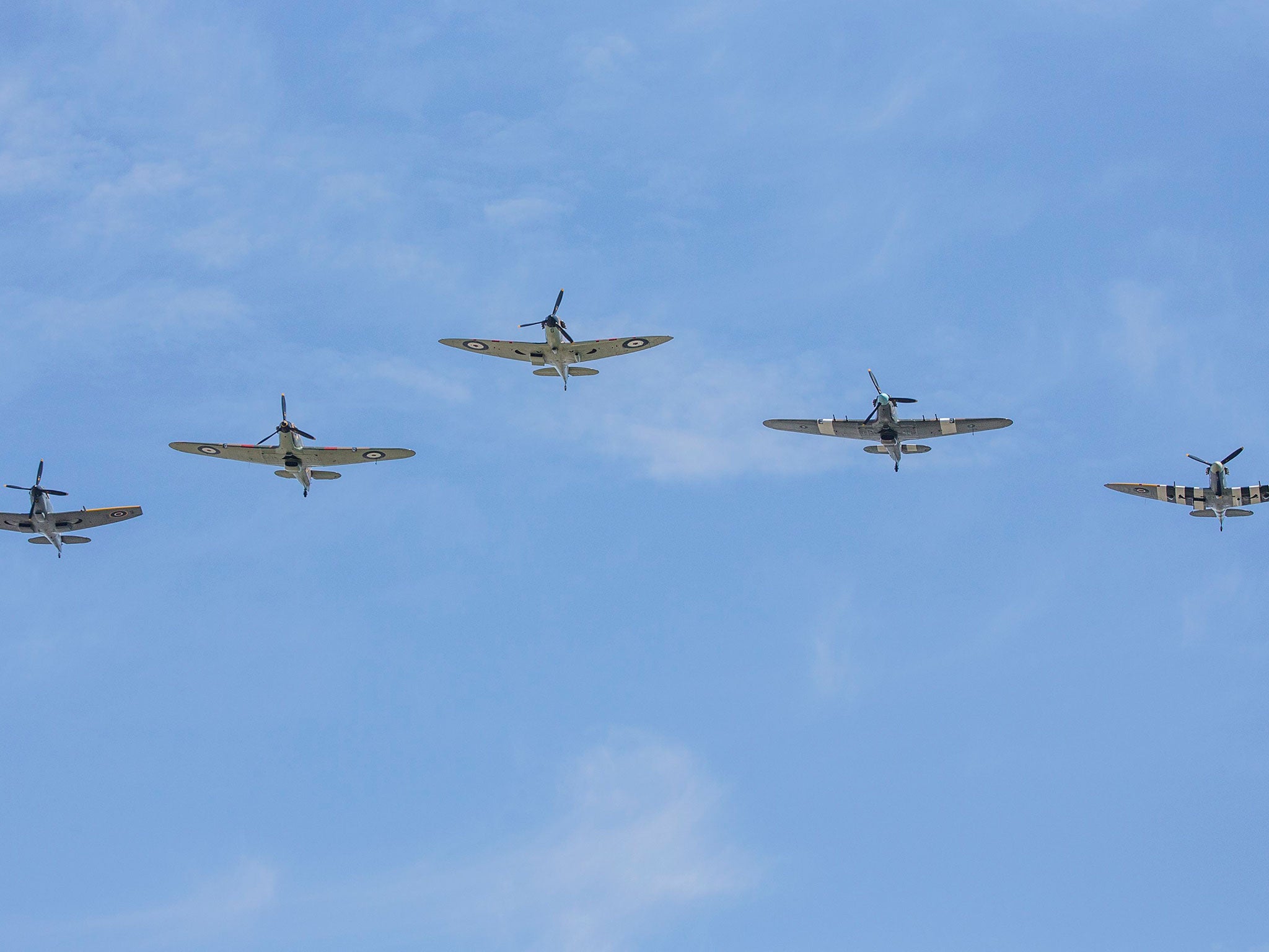 Ministry of Defence handout photo of Spitfires and Hurricanes from the Battle of Britain Memorial flight flying over Buckingham Palace