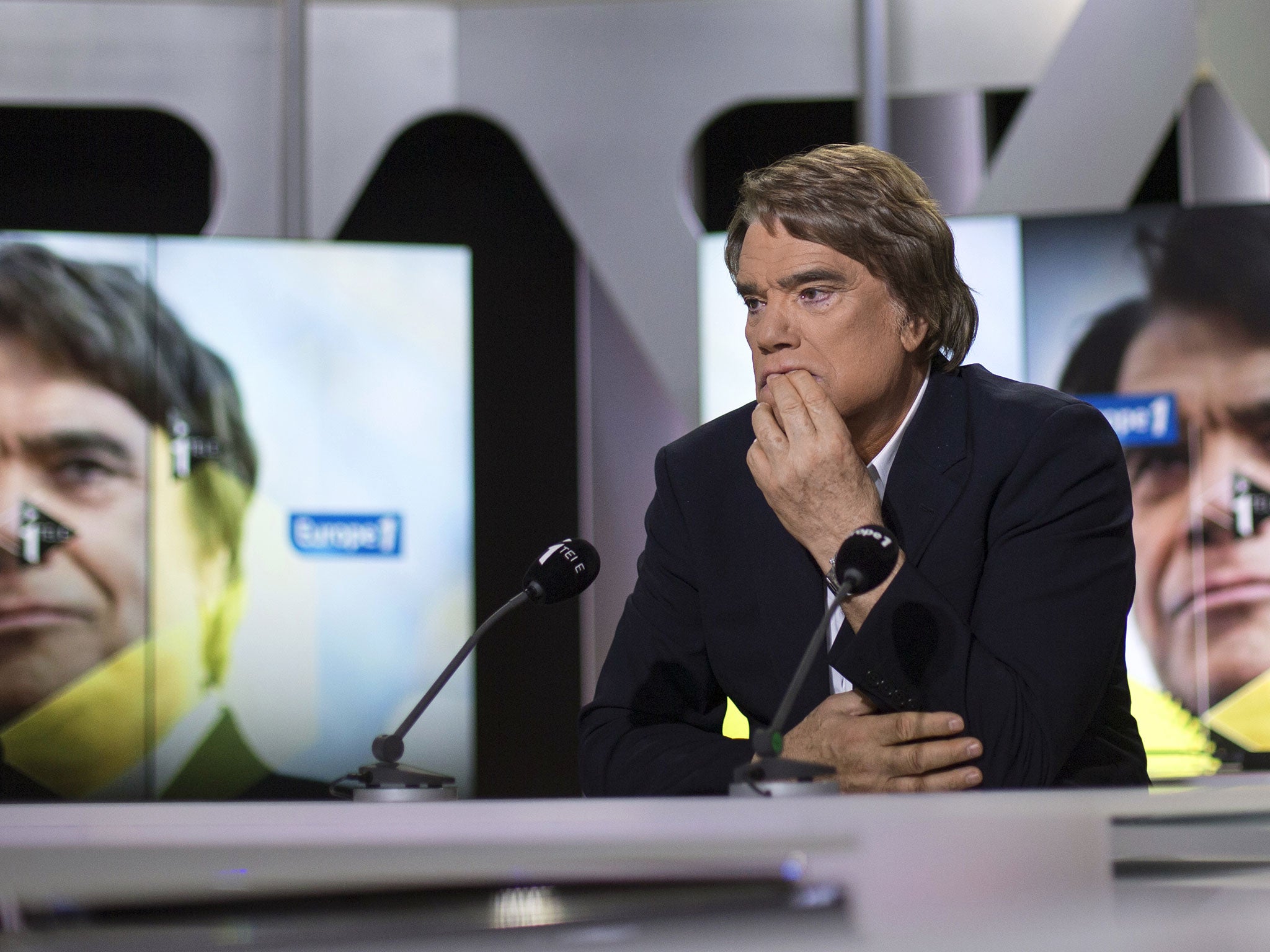 Embattled tycoon Bernard Tapie attends a broadcasted debate on French news channel iTele