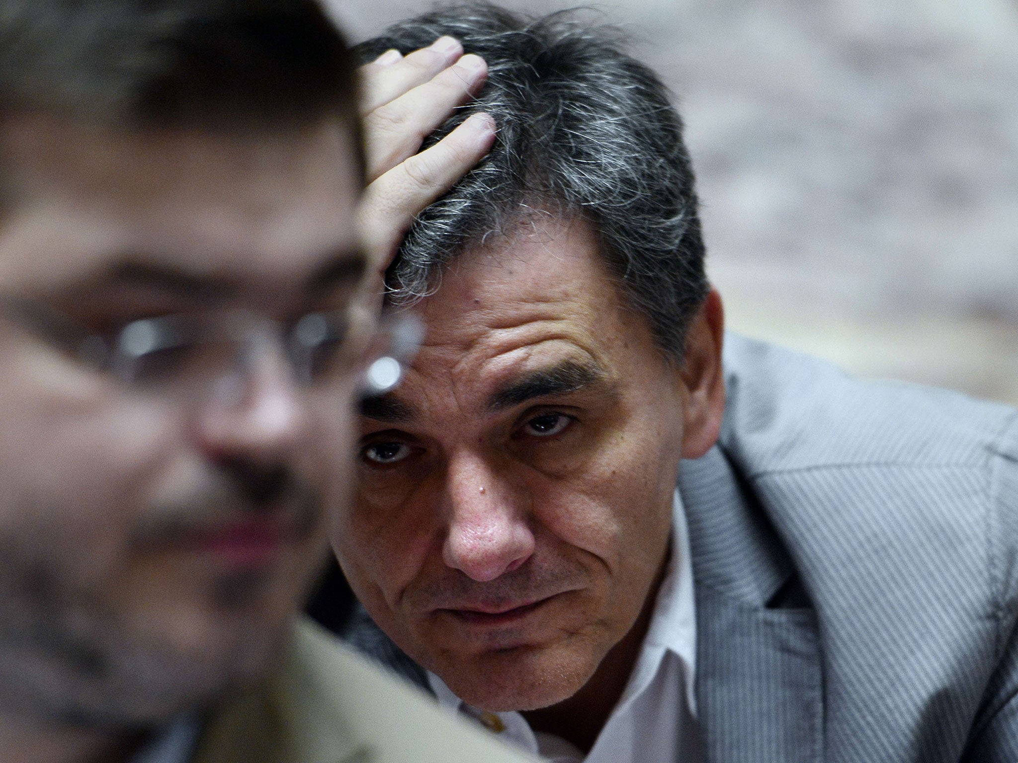 Greek Finance Minister Euclid Tsakalotos arrives for party's parliamentary group meeting