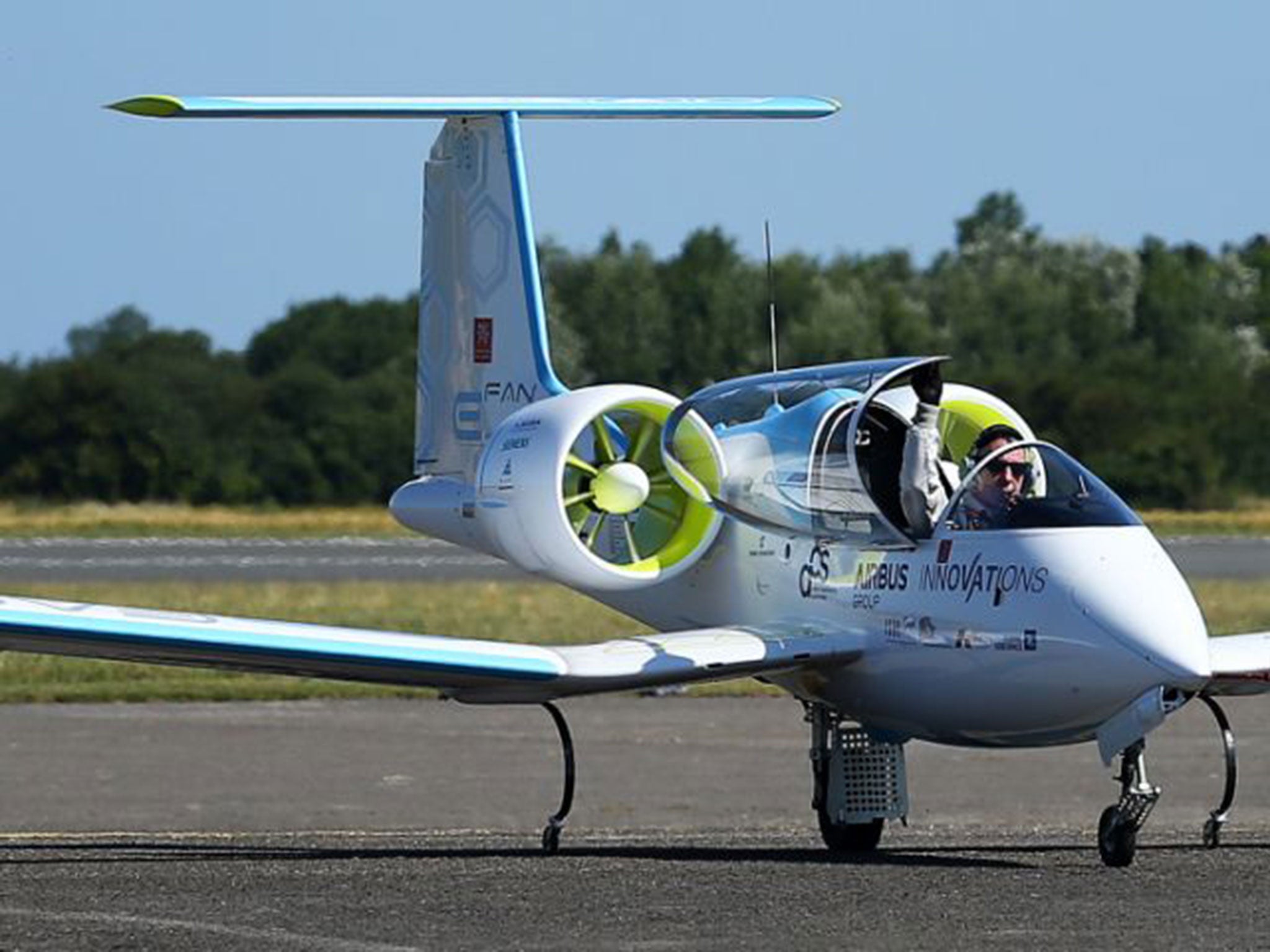 Pilot Didier Estyene celebrates after landing the E-Fan electrically powered plane following his successful crossing of The Channel