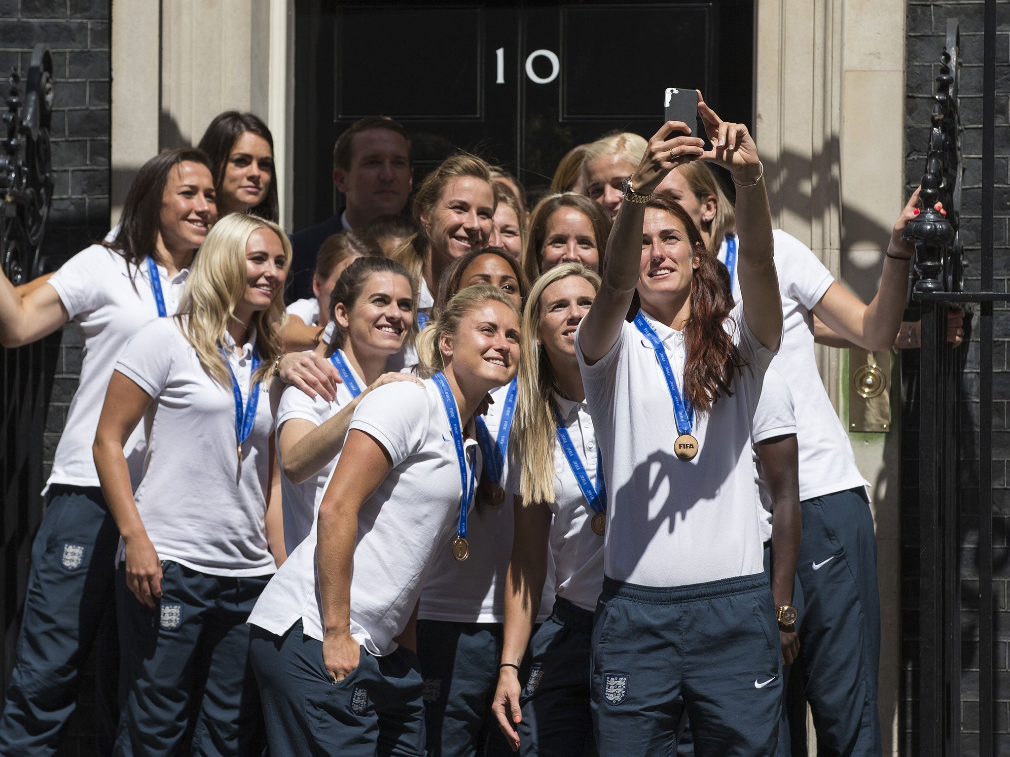 The England Women’s World Cup team pose for a selfie with David Cameron outside 10 Downing Street