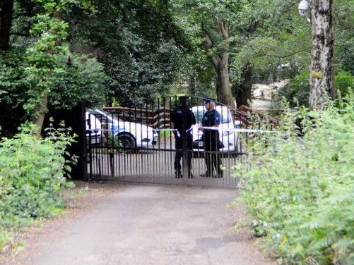 Police at the home of John 'Goldfinger' Palmer, after he was killed in his garden under a hail of bullets