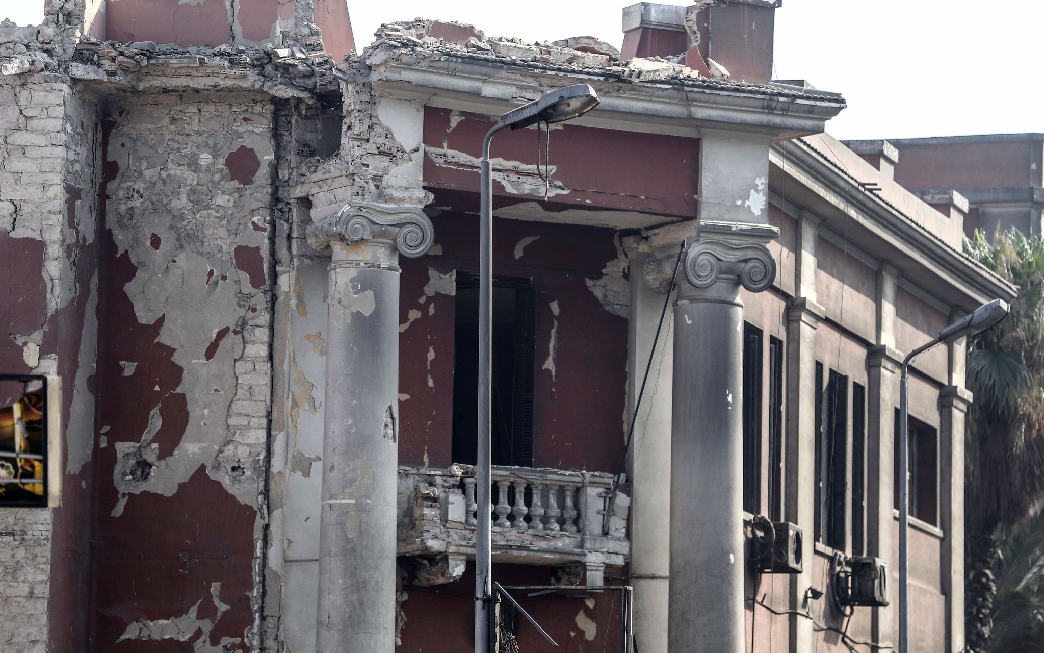 The red-facaded Italian Consulate was seriously damaged in the early-morning blast