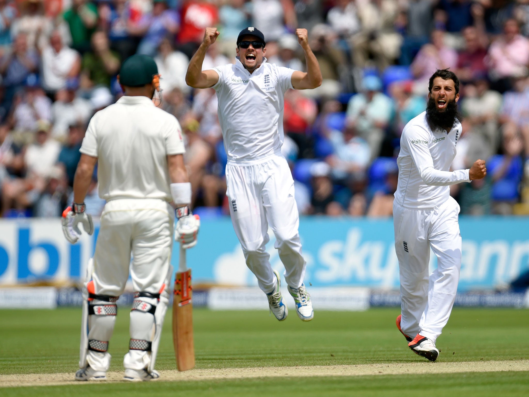 Alastair Cook leaps in joy as Moeen Ali traps David Warner lbw