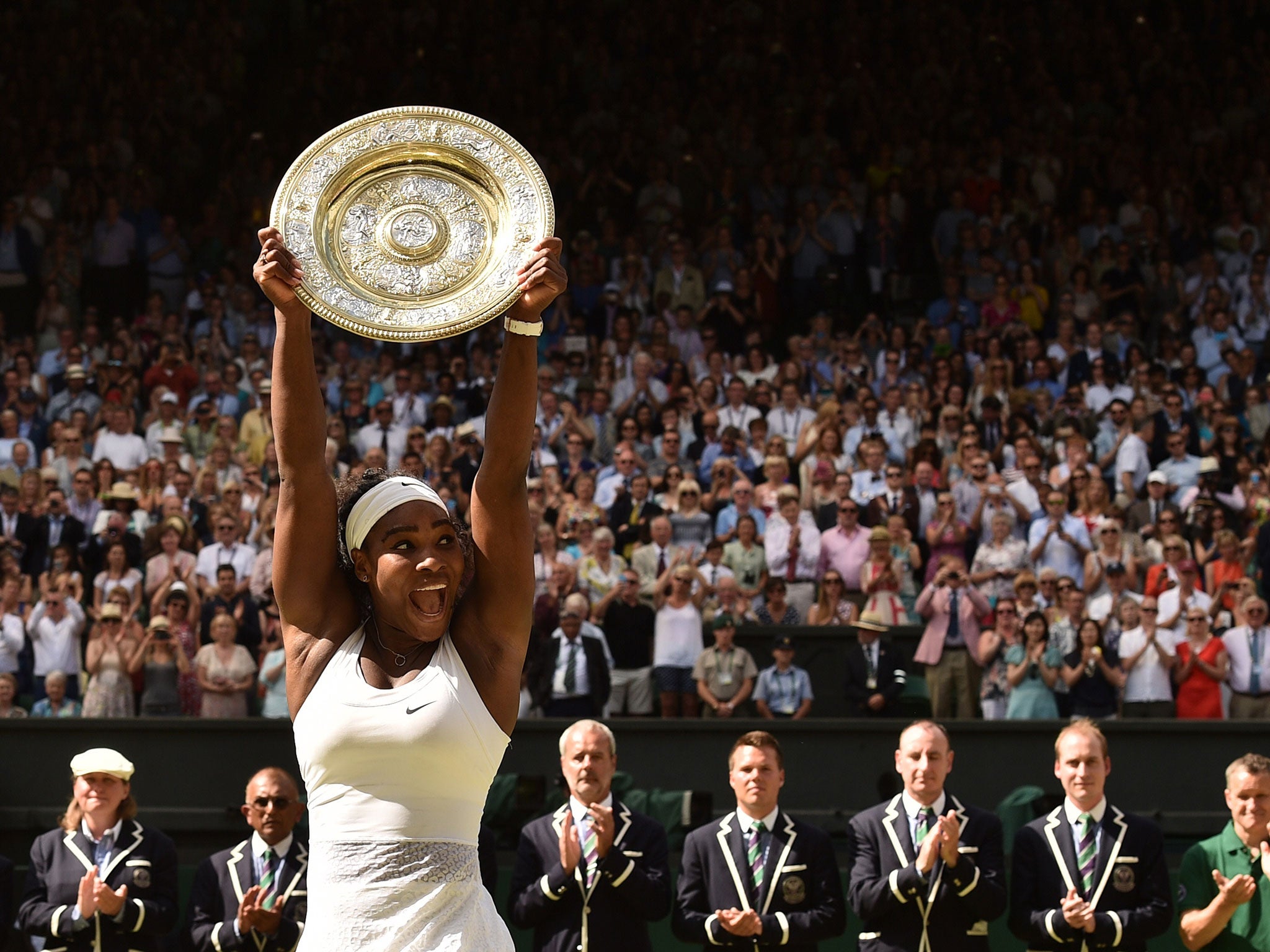 Serena Williams lifts the Wimbledon trophy after her victory over Garbine Muguruza