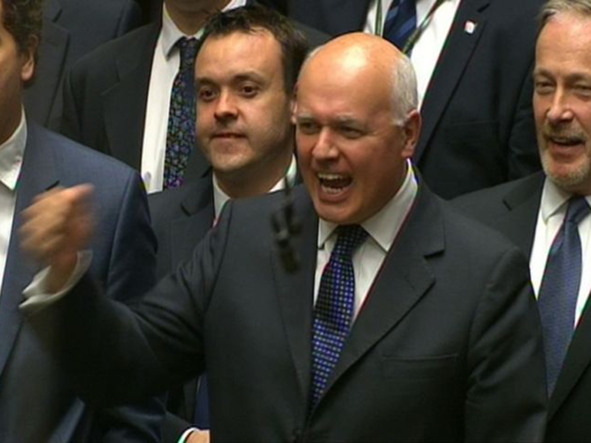 Iain Duncan Smith can hardly control his emotion as George Osborne announces the introduction of a compulsory national minimum wage