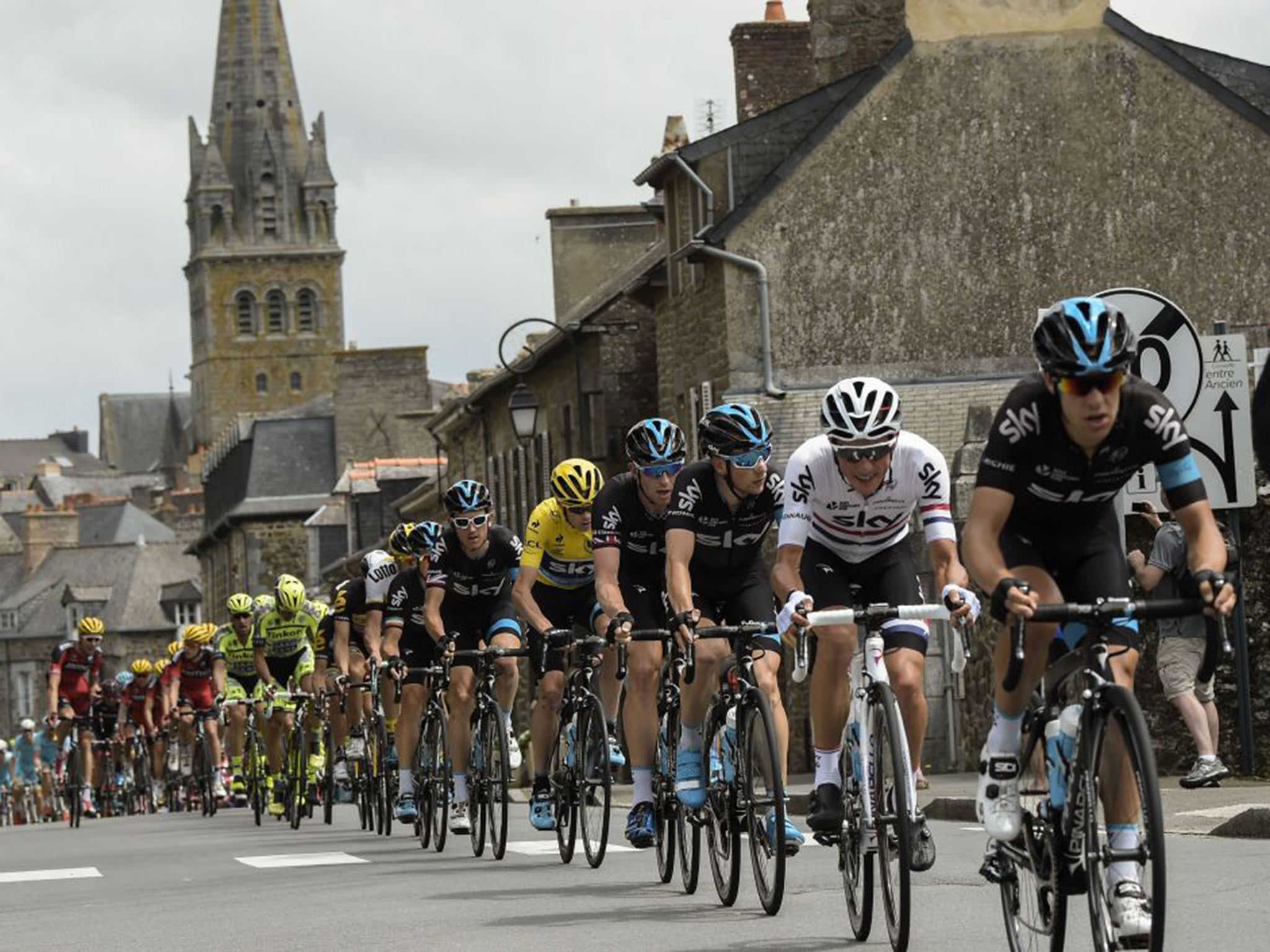 Chris Froome (yellow) rides in the pack during Saturday's 181km eighth stage