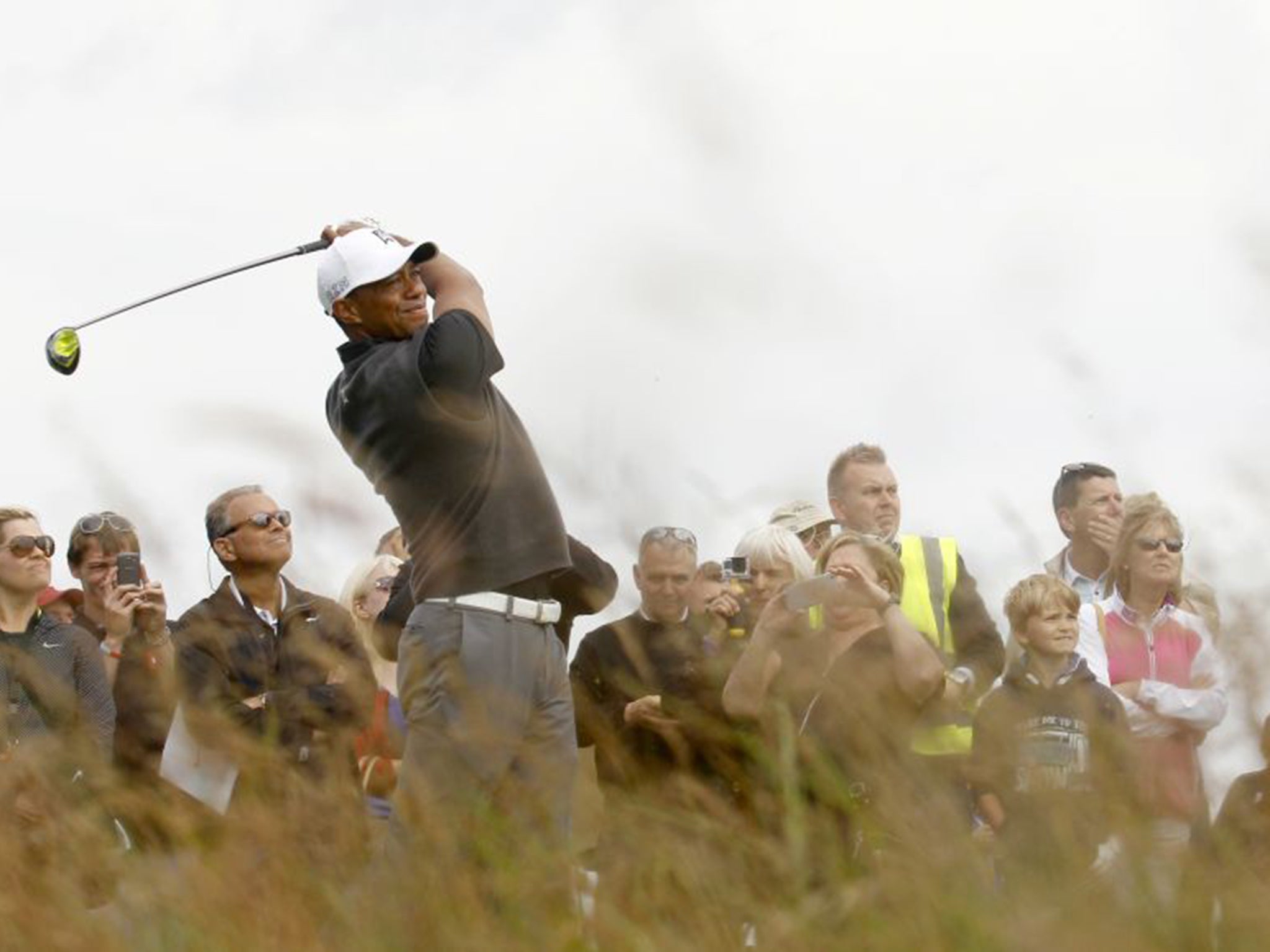 Tiger Woods drives off at the 17th hole of St Andrews during Saturday's practice round