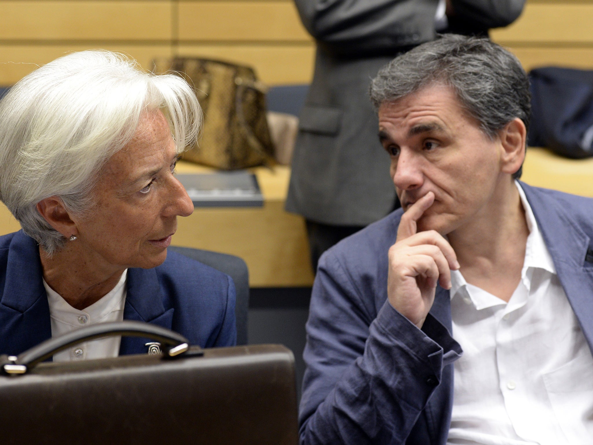 Greek Finance Minister Euclid Tsakalotos speaks with the Managing Director of the International Monetary Fund Christine Lagarde July 2015