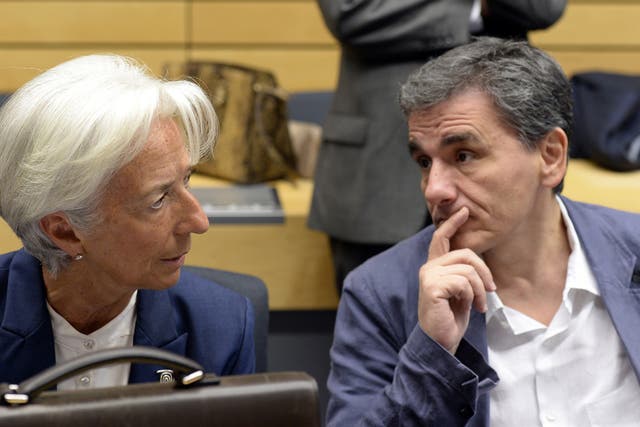 Greek Finance Minister Euclid Tsakalotos speaks with the Managing Director of the International Monetary Fund Christine Lagarde July 2015
