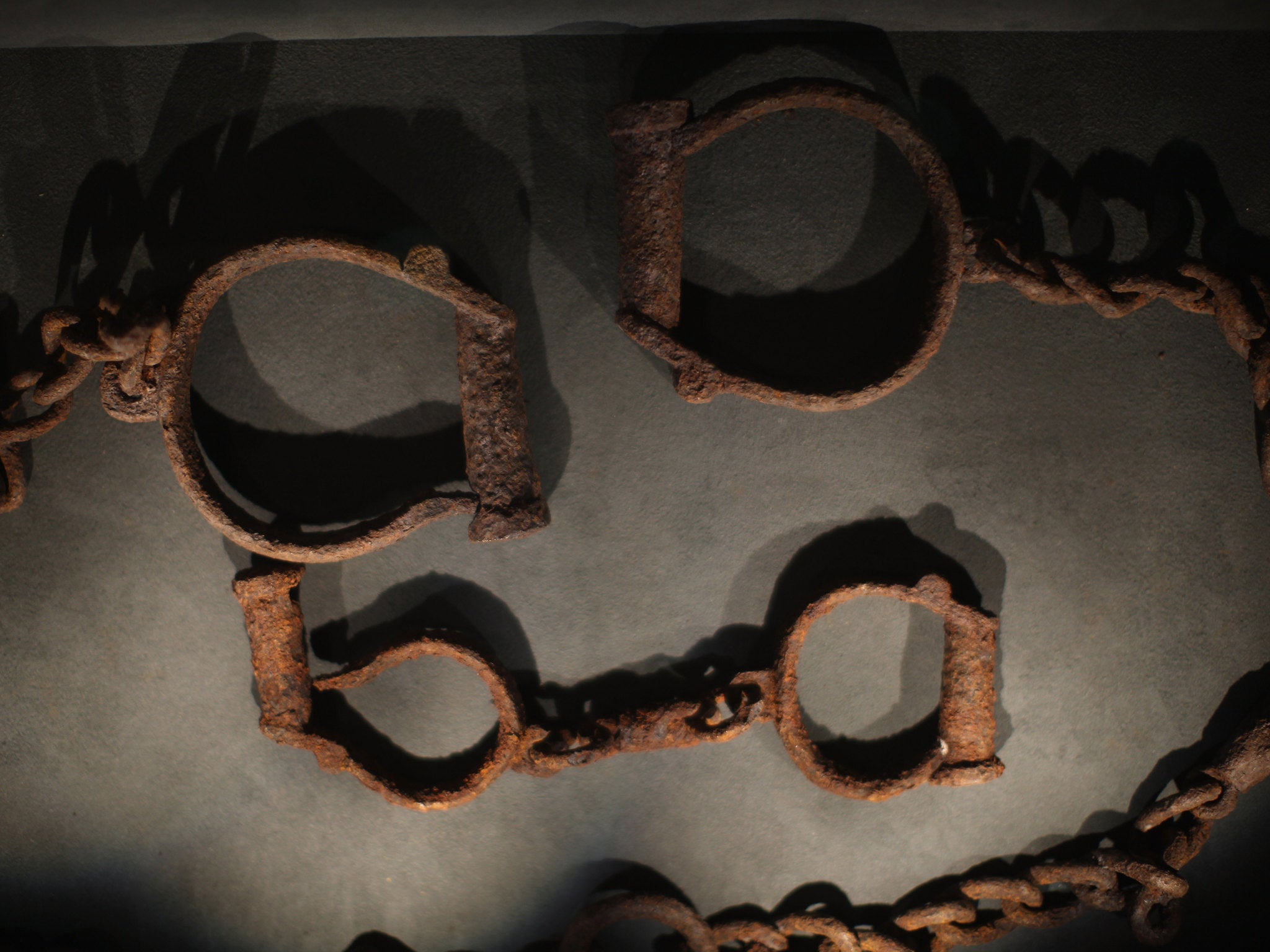 LIVERPOOL, ENGLAND - FEBRUARY 09: Shackles which were used to tether slaves on display at the International Slavery Museum on February 9, 2012 in Liverpool, England. The maritime city of Liverpool has seven museums of national importance which include the