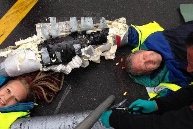 Activists chained themselves to the tarmac at Heathrow with arm locks