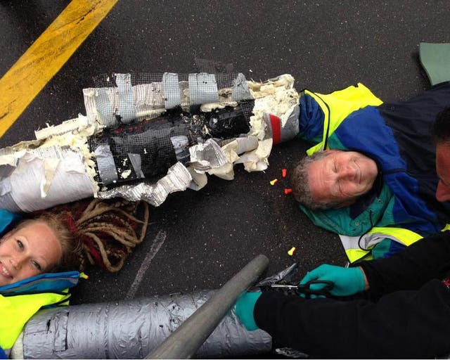 Activists chained themselves to the tarmac at Heathrow with arm locks